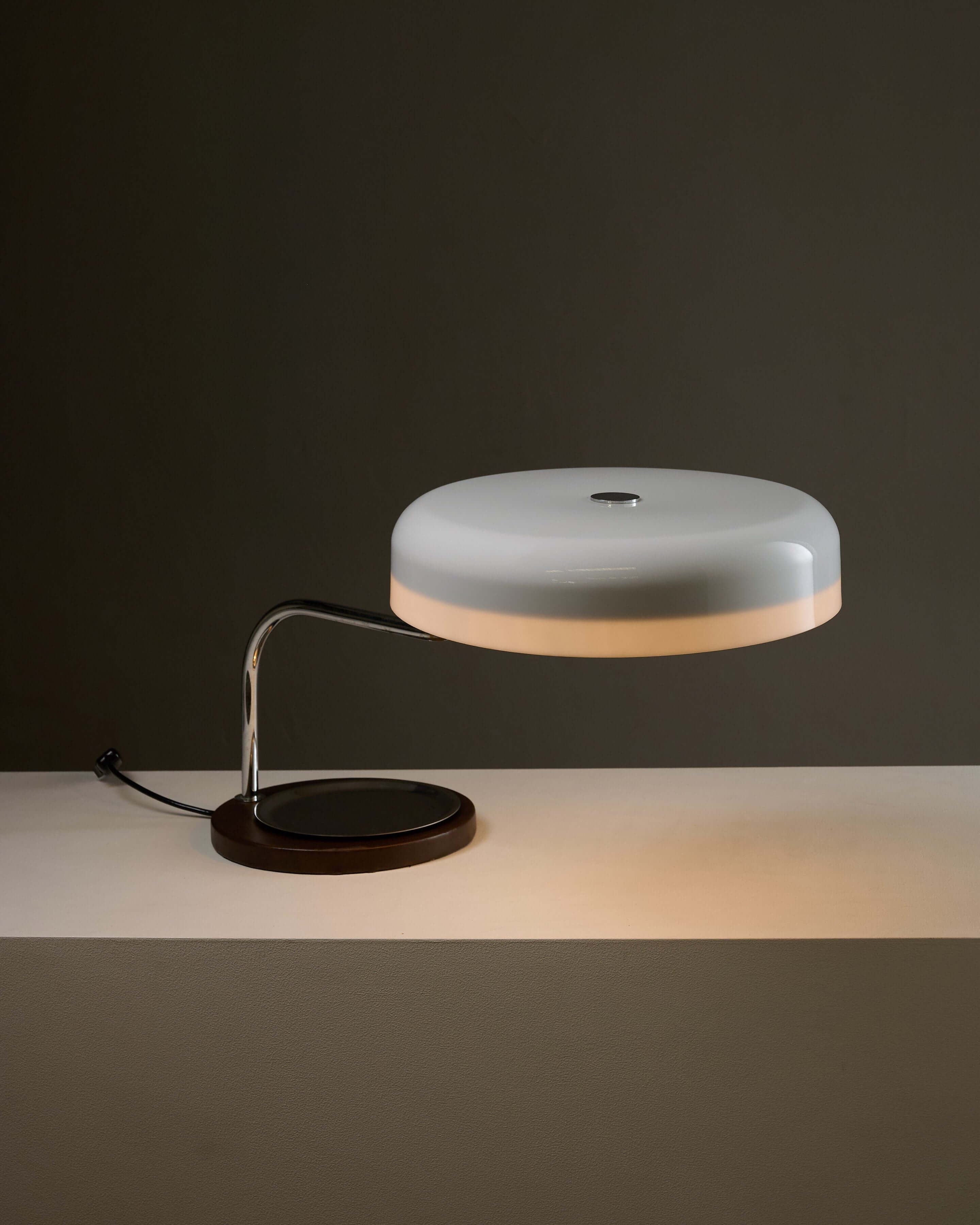 Metalarte Model 4817 Desk Lamp by Gaetano Scolari on a table with a modern design.