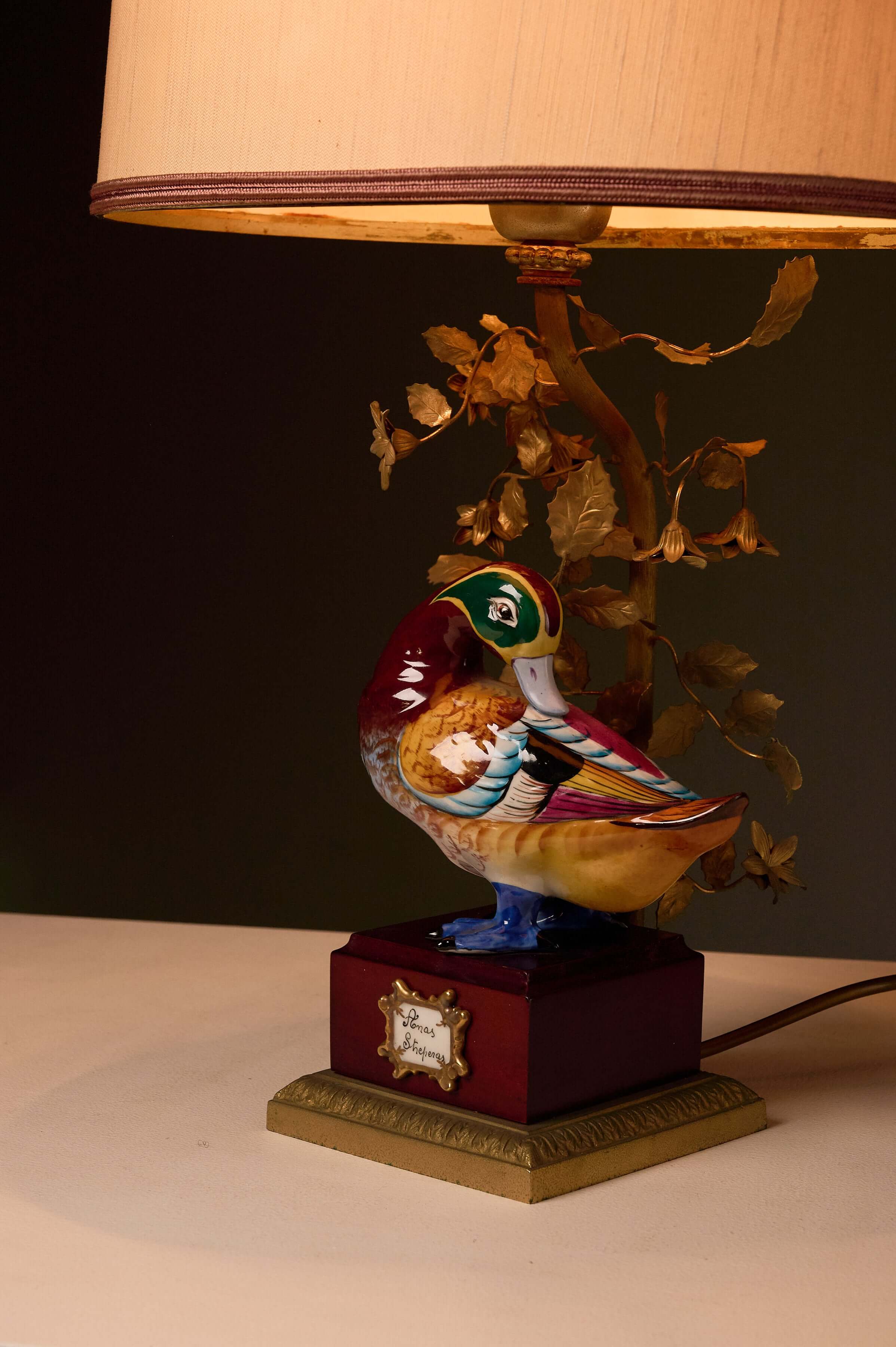 Porcelain 'Anas Strepera' Duck Table Lamp with Brass Foliage featuring a vibrant hand-painted duck design.