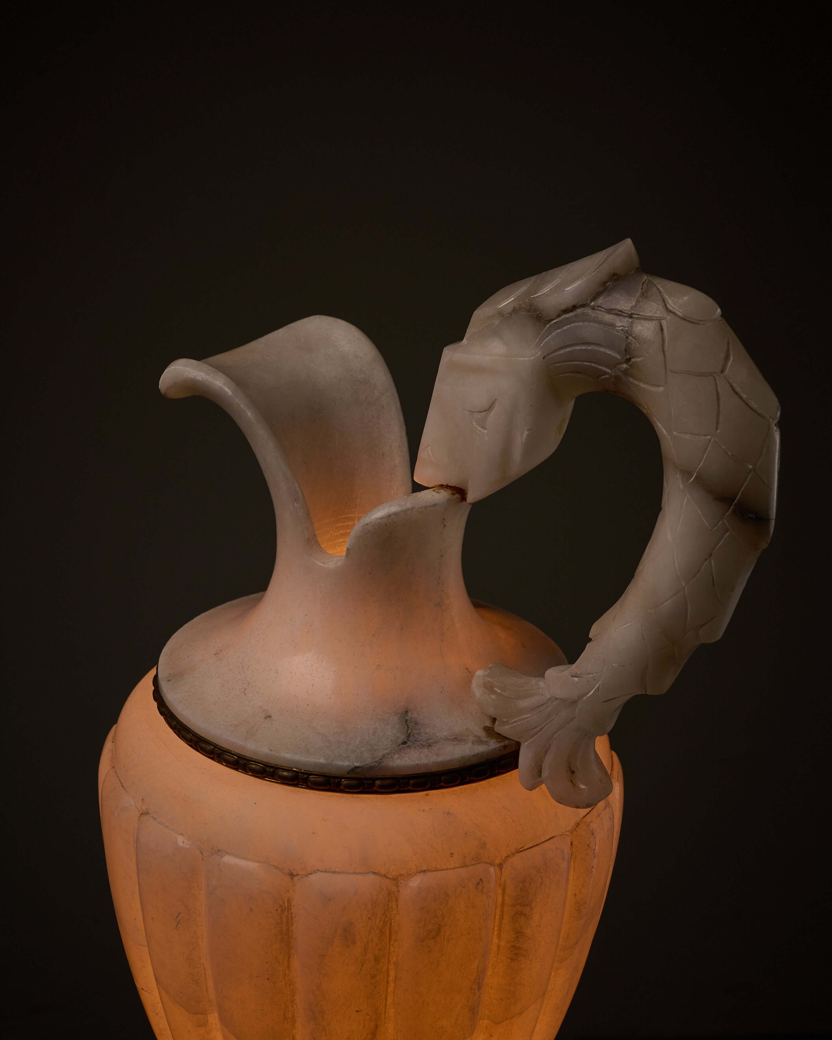 Carved Alabaster Urn Lamp with Stylized Fish Handle showcasing elegant fish handle and soft glowing light.