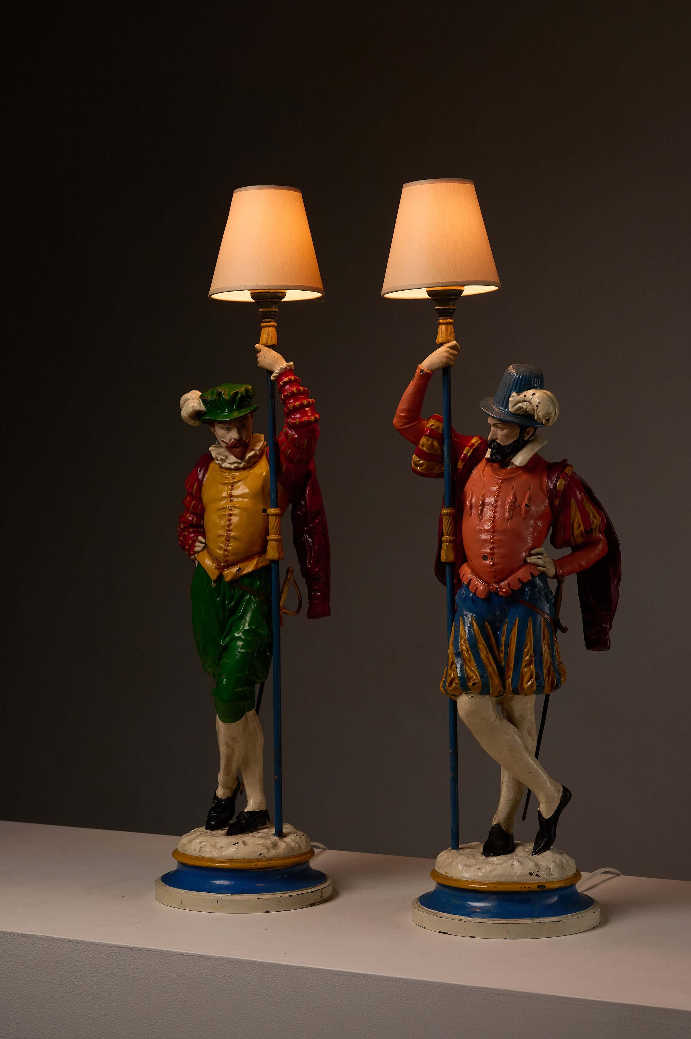 Pair of Painted Cast Iron Guard Figures Table Lamps featuring colorful musketeer figures.