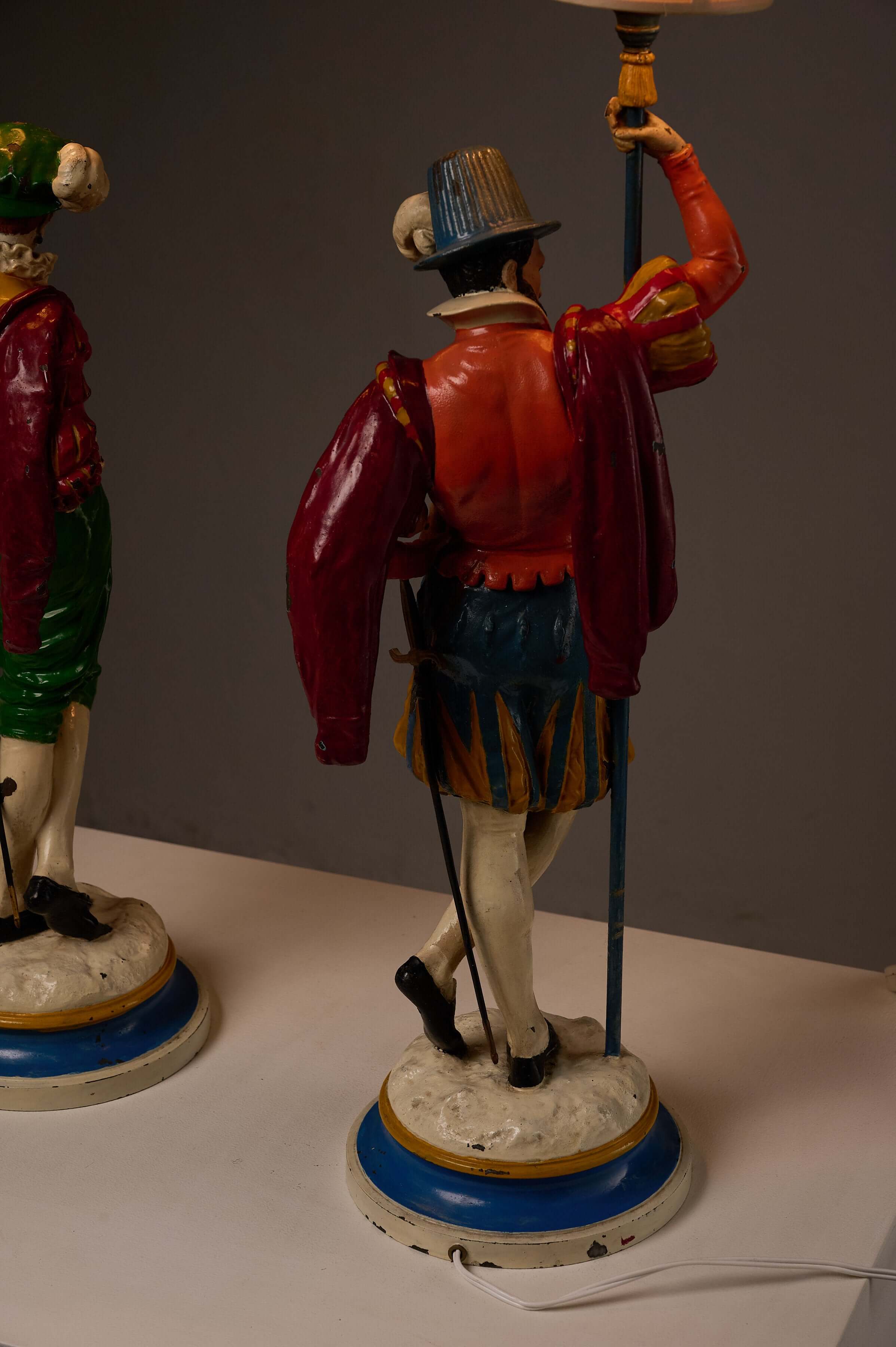 Pair of Painted Cast Iron Guard Figures Table Lamps showcasing colorful details of 16th-century musketeer figures.