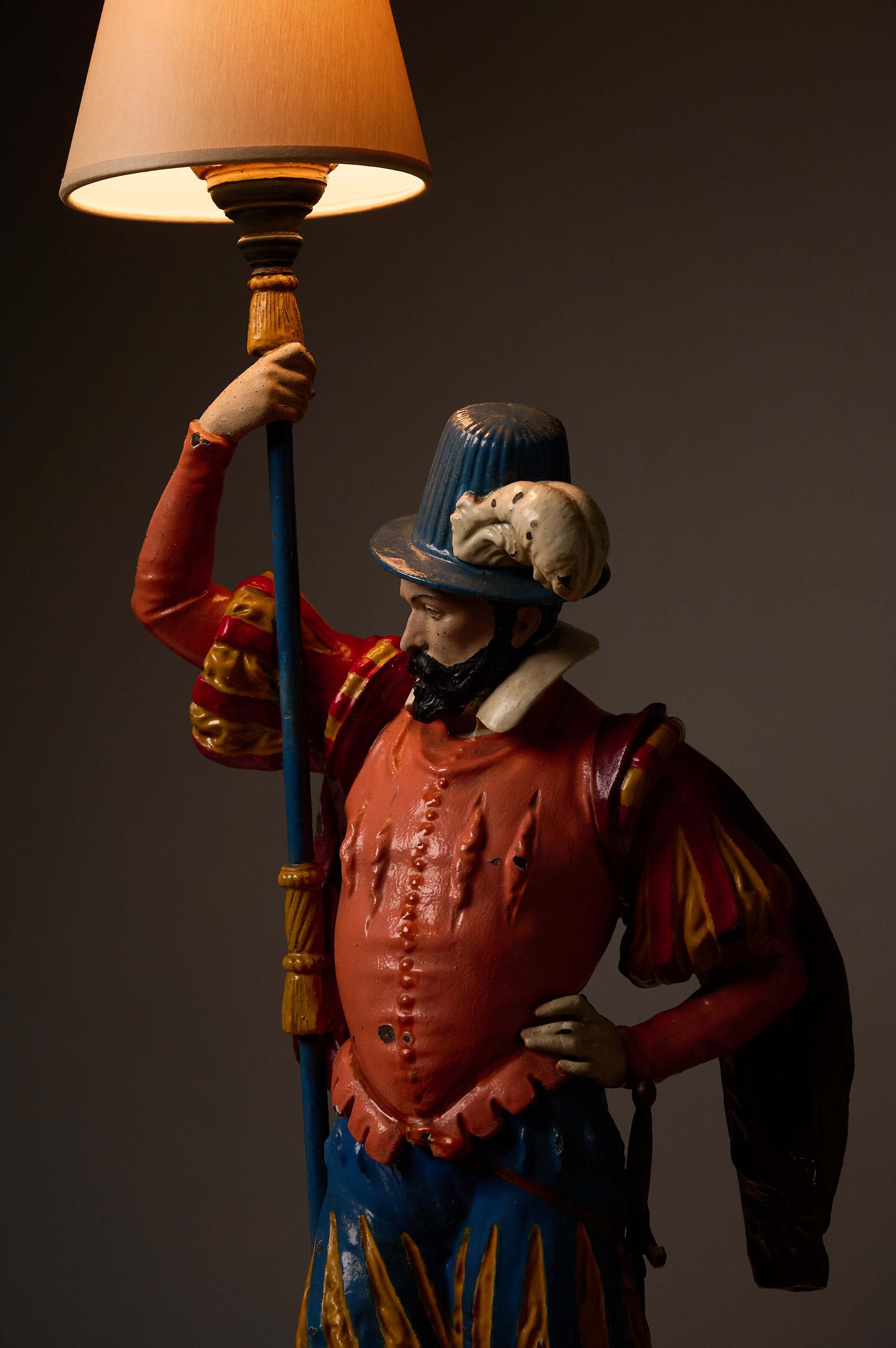 Pair of Painted Cast Iron Guard Figures Table Lamps featuring a musketeer holding a lamp.