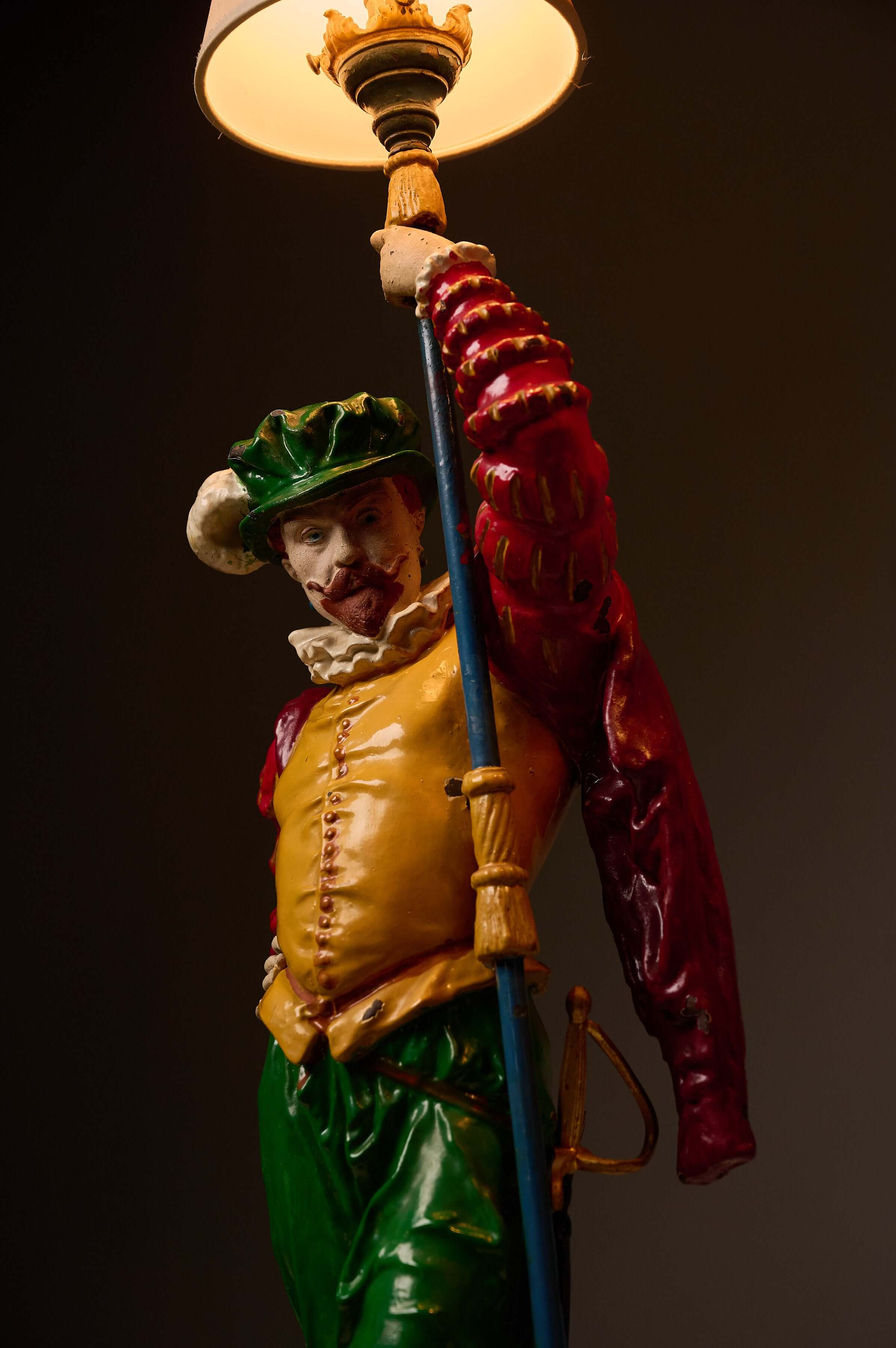 Pair of Painted Cast Iron Guard Figures Table Lamps featuring a colorful musketeer figure holding a lamp.