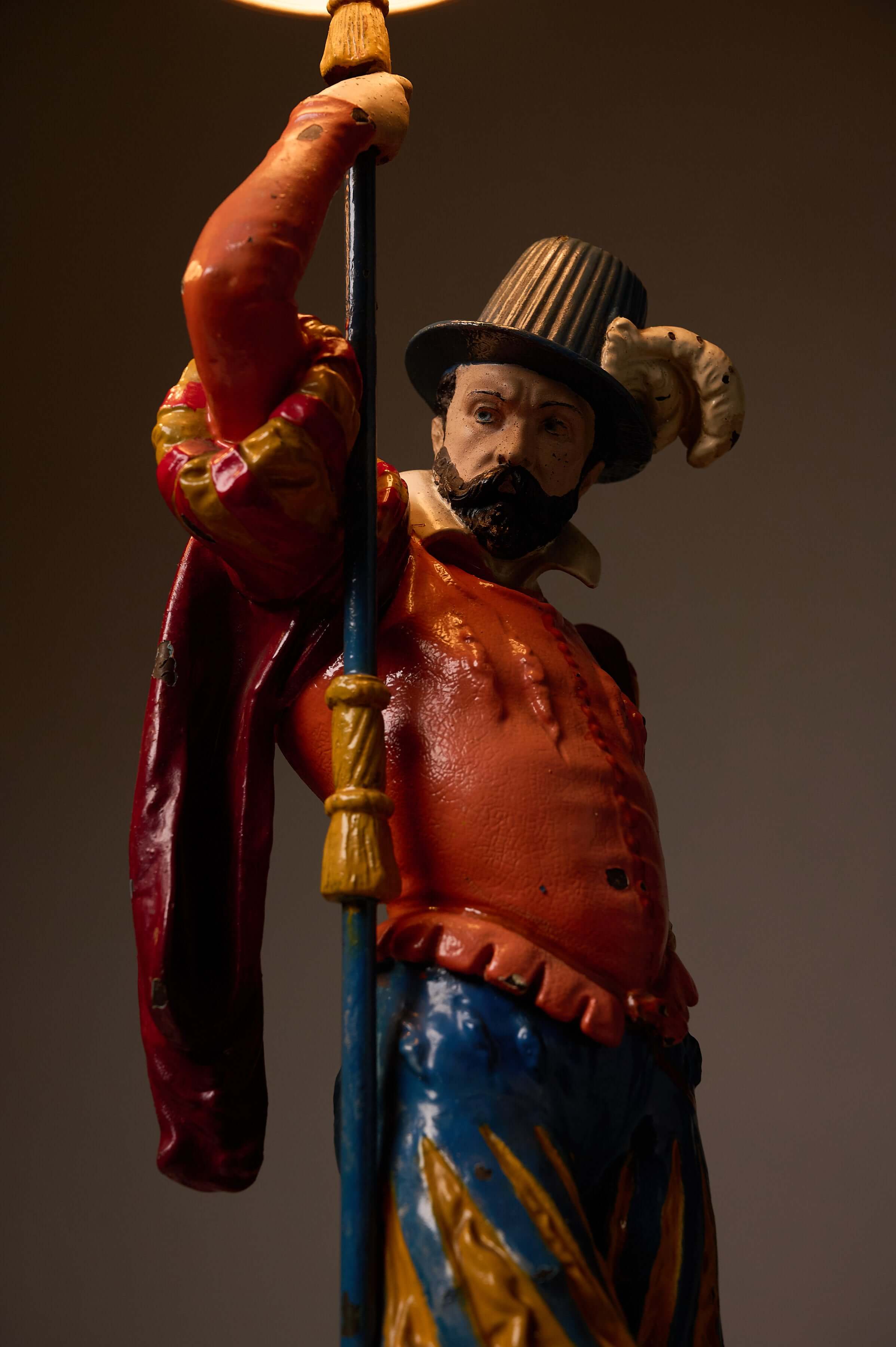 Pair of Painted Cast Iron Guard Figures Table Lamps with colorful musketeer design and intricate details.