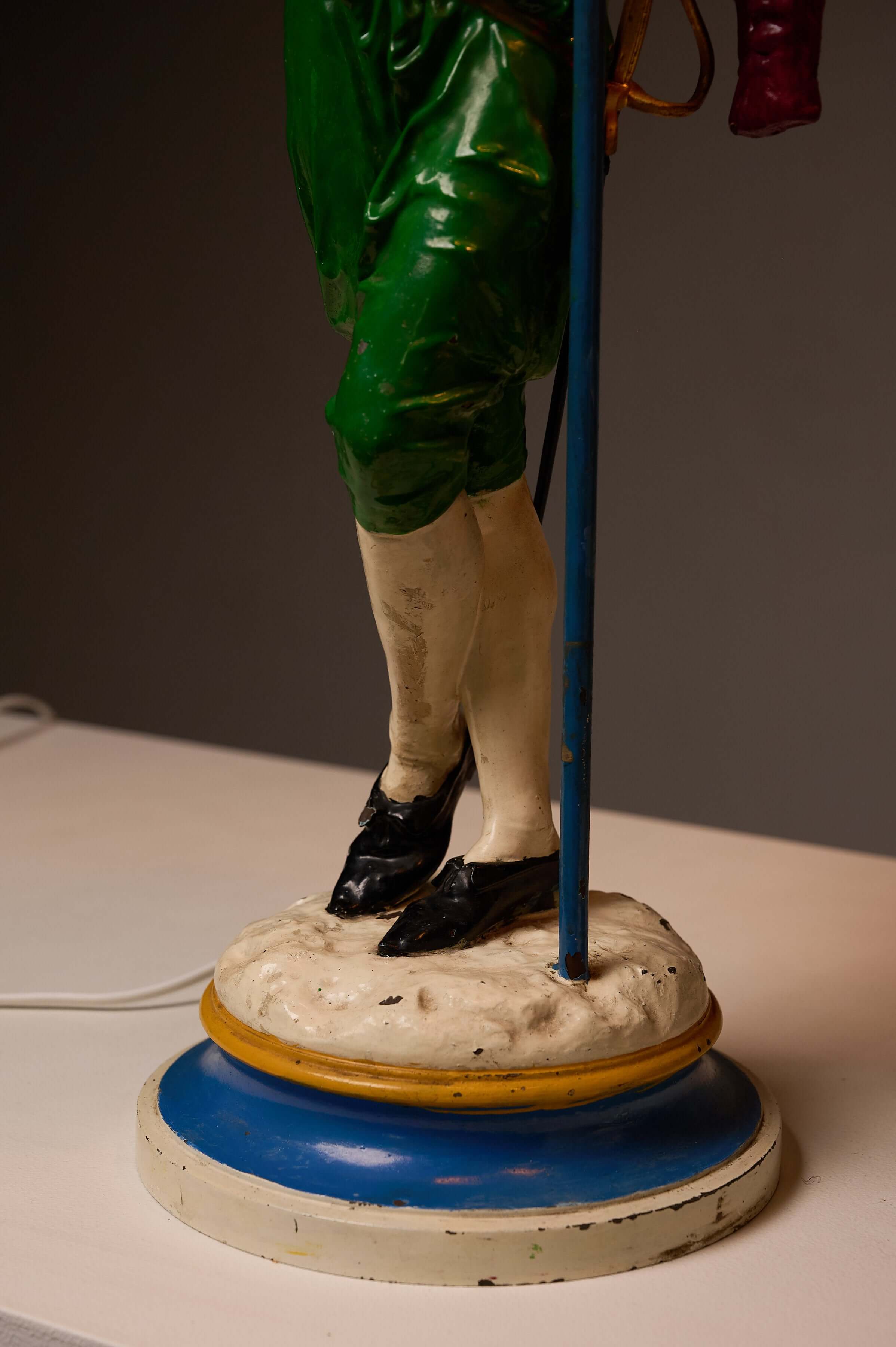 Pair of Painted Cast Iron Guard Figures Table Lamps showing the detailed base and foot of a musketeer lamp.