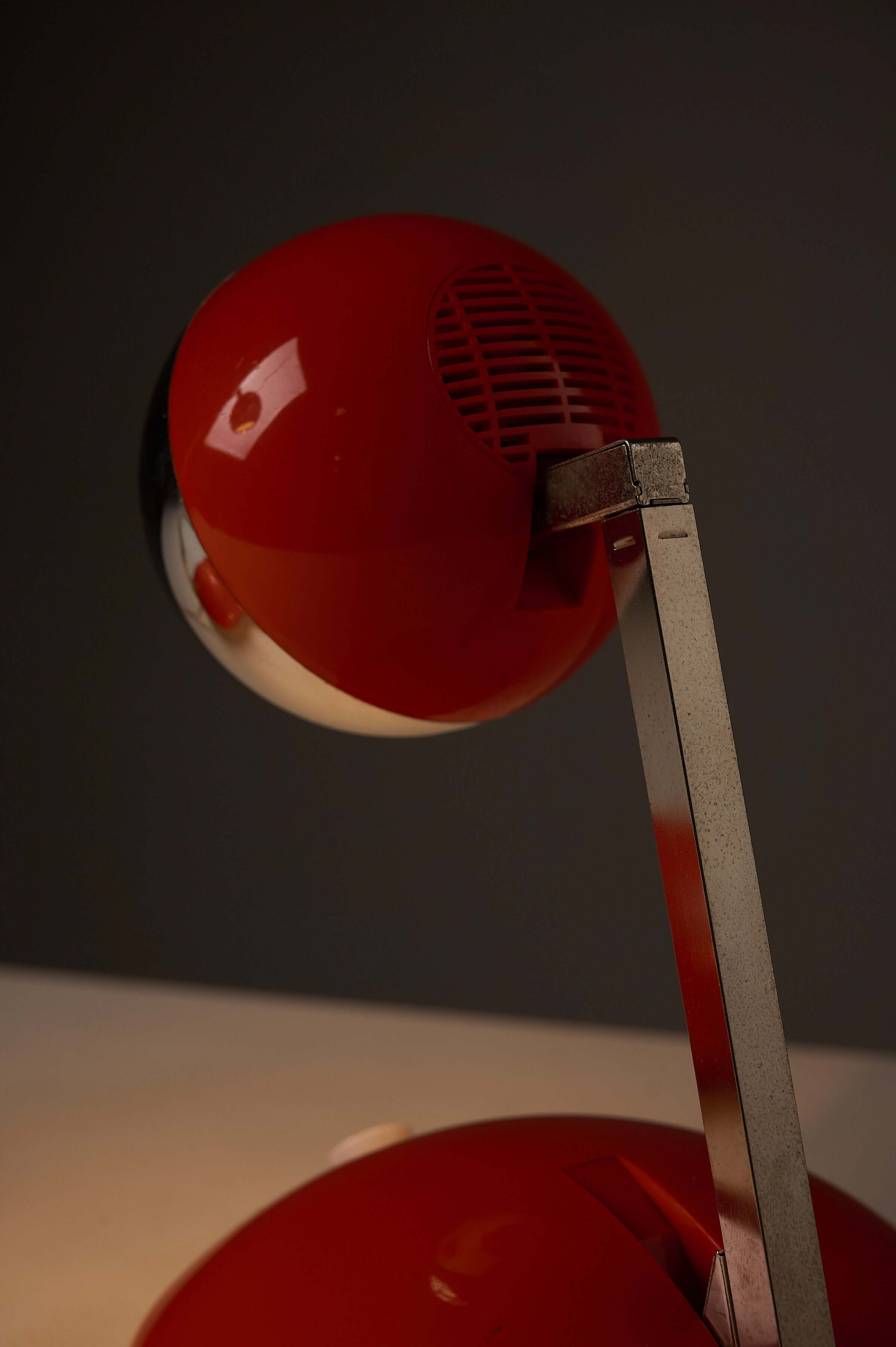 1970s Orange Pop Art Desk Lamp with a telescoping chrome arm and bright orange base.