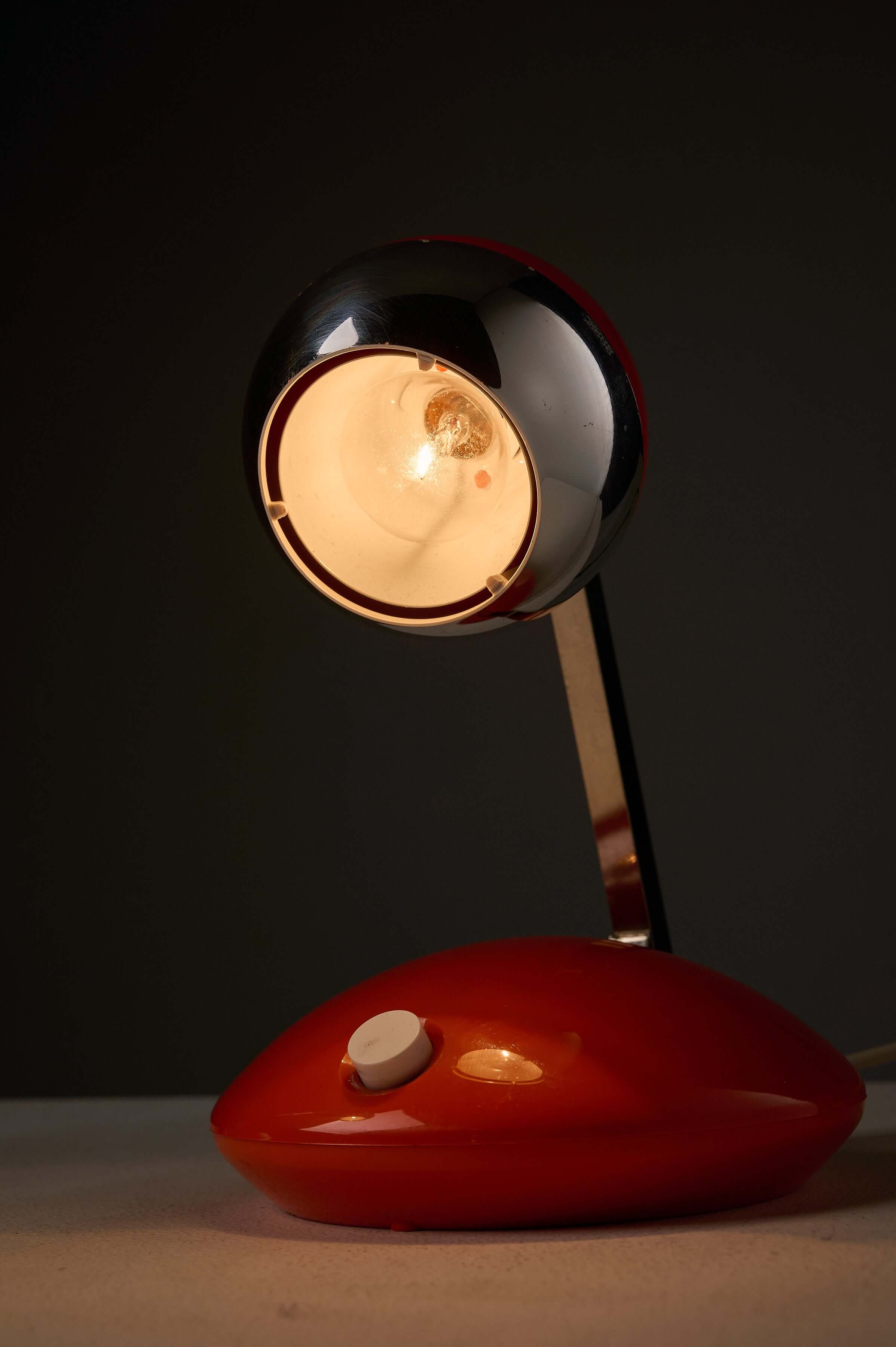 1970s Orange Pop Art Desk Lamp featuring a telescoping chrome arm and vibrant orange base.