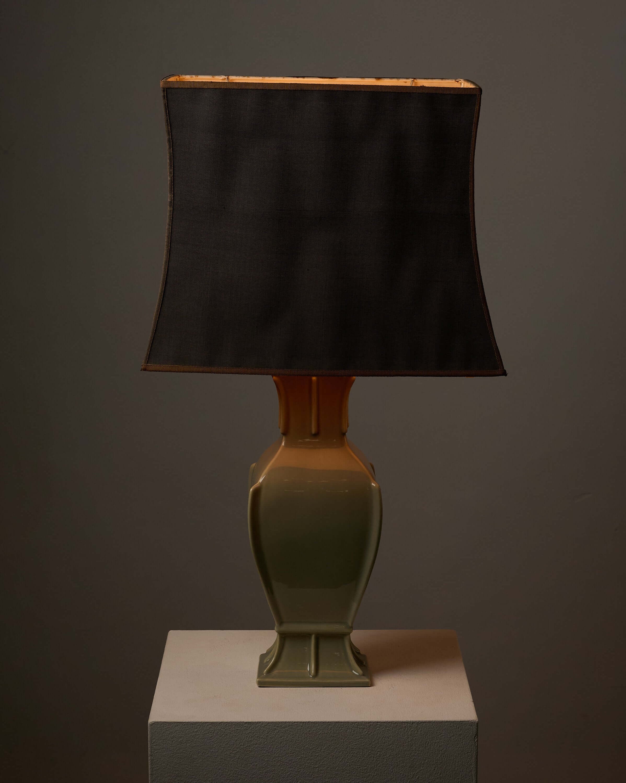 Mid-Century Neoclassical Green Ceramic Table Lamp with a rectangular shade and olive green baluster design.
