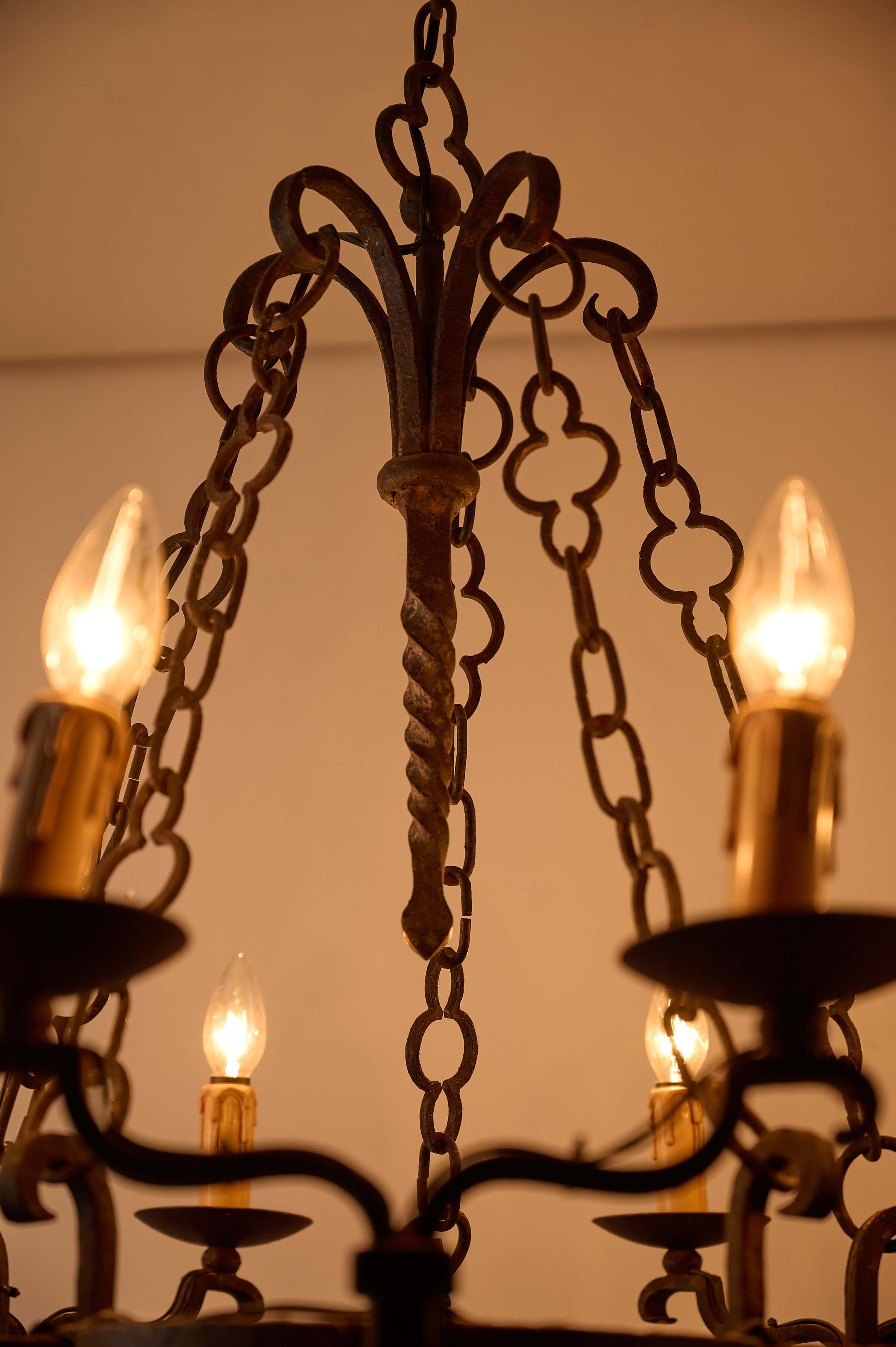 Gothic Style Chandelier with Chain Suspension featuring wrought iron and candle-style lights.