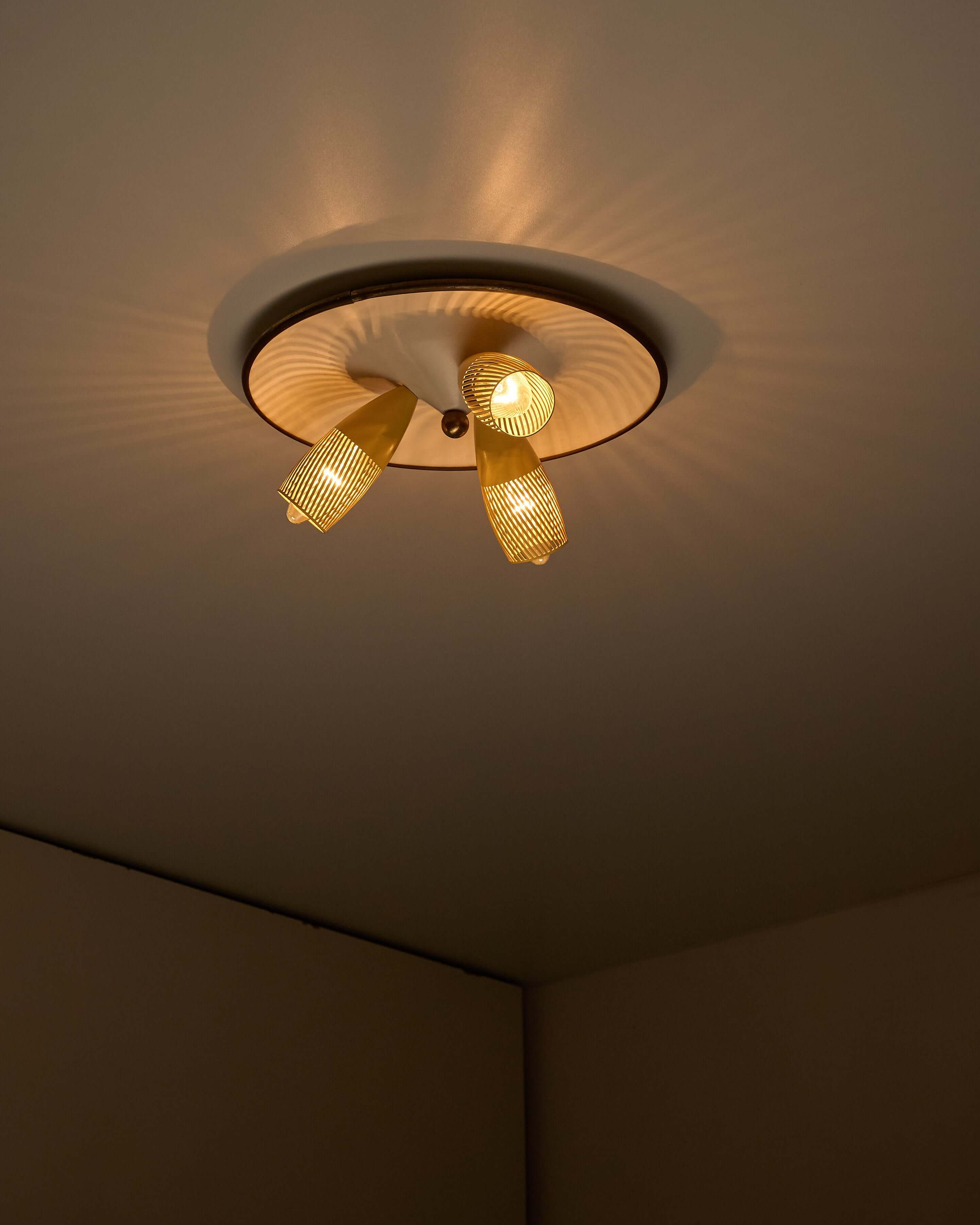 Mid-Century Yellow & Brass Ceiling Lamp by Hillebrand with perforated shades and adjustable spotlights.