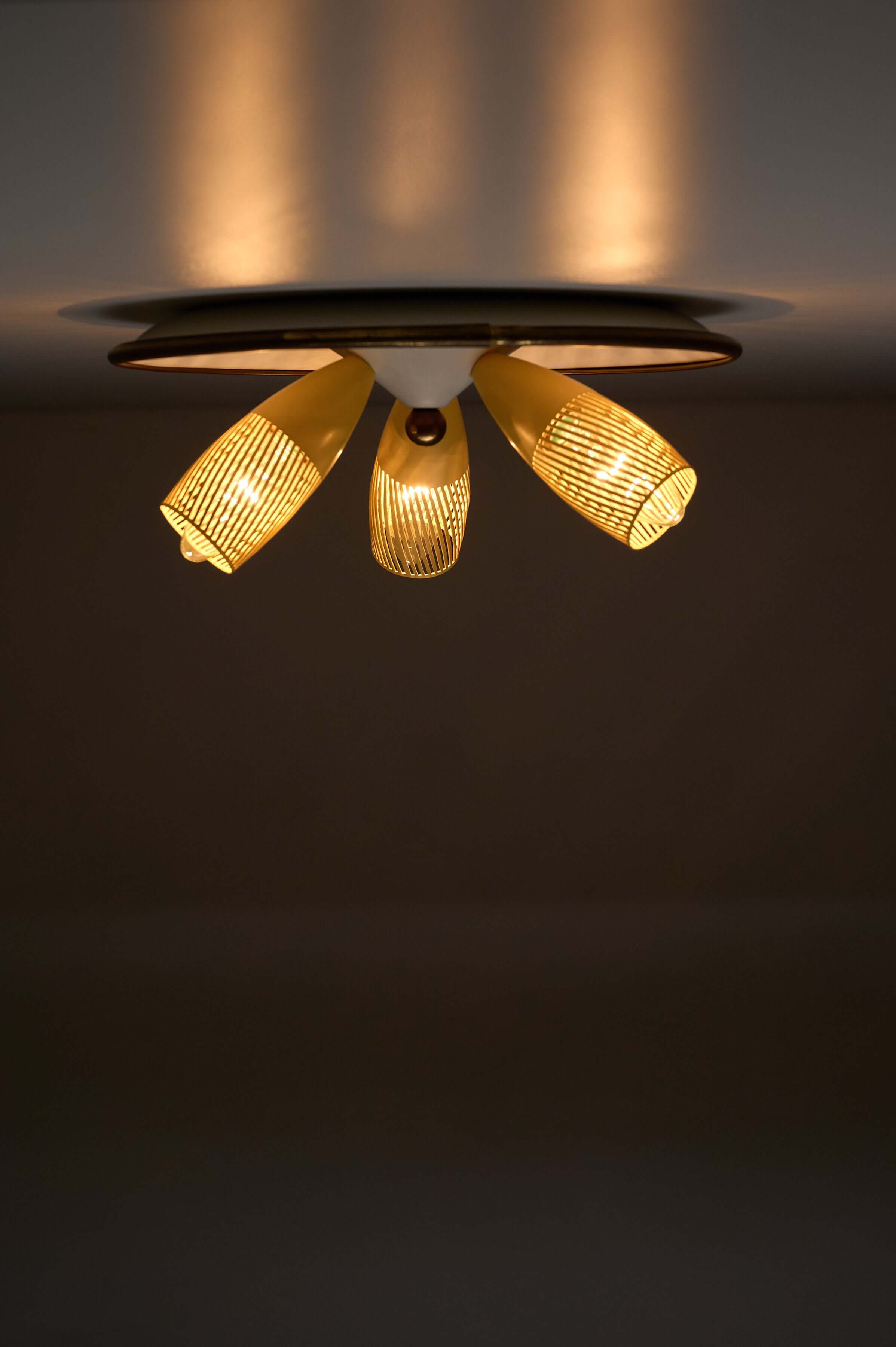 Mid-Century Yellow & Brass Ceiling Lamp by Hillebrand with three yellow perforated shades.