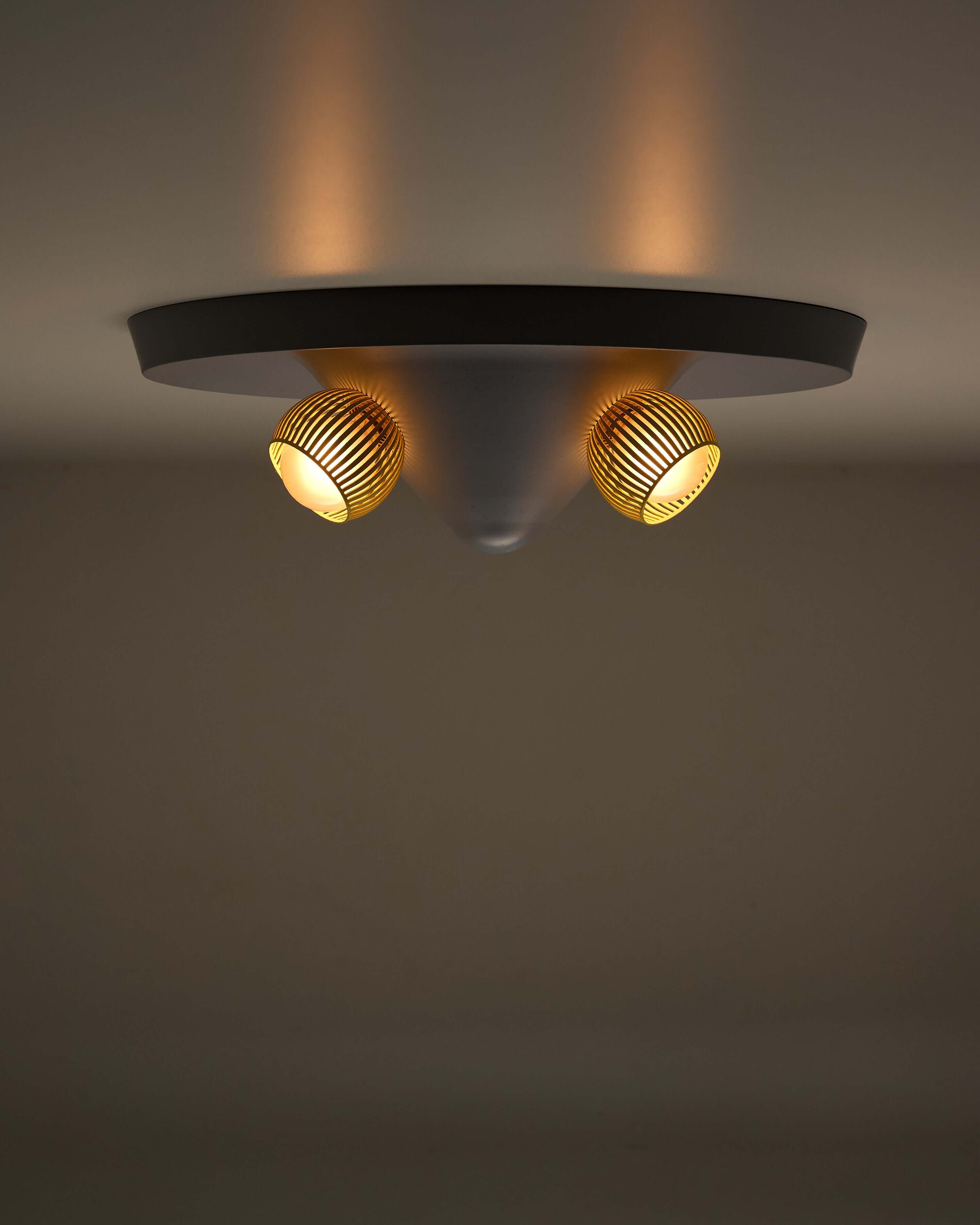Mid-Century Grey Ceiling Flush Mount with Yellow Perforated Shades illuminating a modern interior.