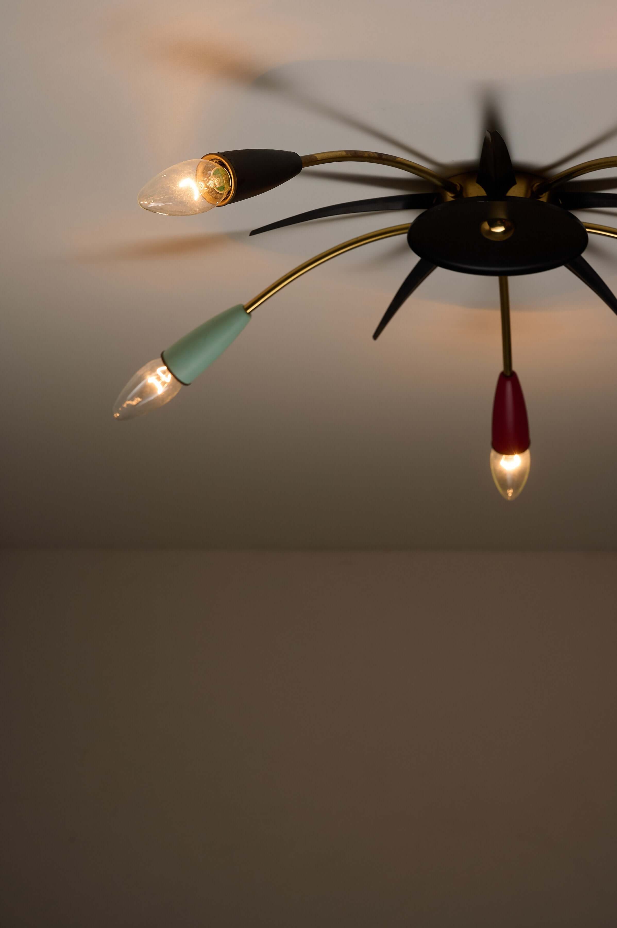 Mid-Century Multicolor Sputnik Ceiling Lamp featuring colorful cone sockets and brass arms in a starburst design.