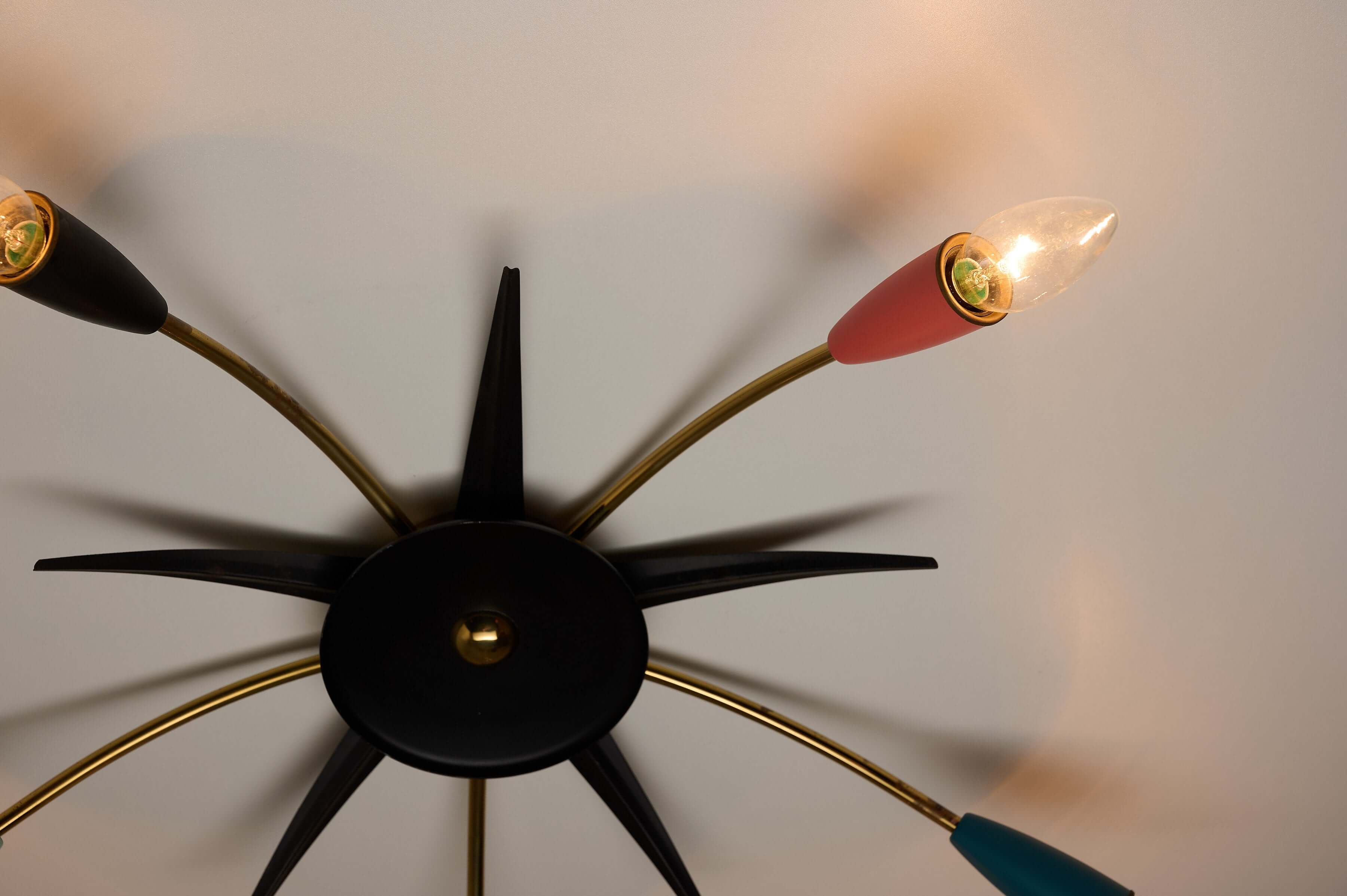 Mid-Century Multicolor Sputnik Ceiling Lamp featuring stylish starburst design with brass arms and colorful metal cones.