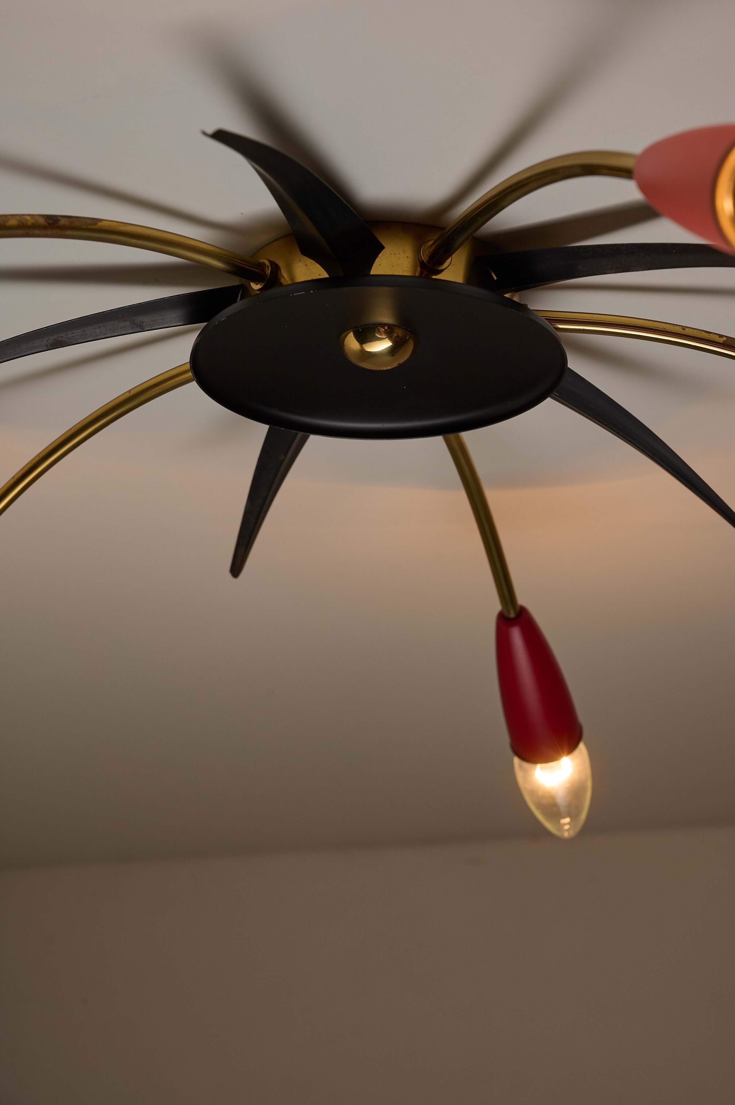 Mid-Century Multicolor Sputnik Ceiling Lamp showcasing brass arms and colorful cone sockets in a starburst design.