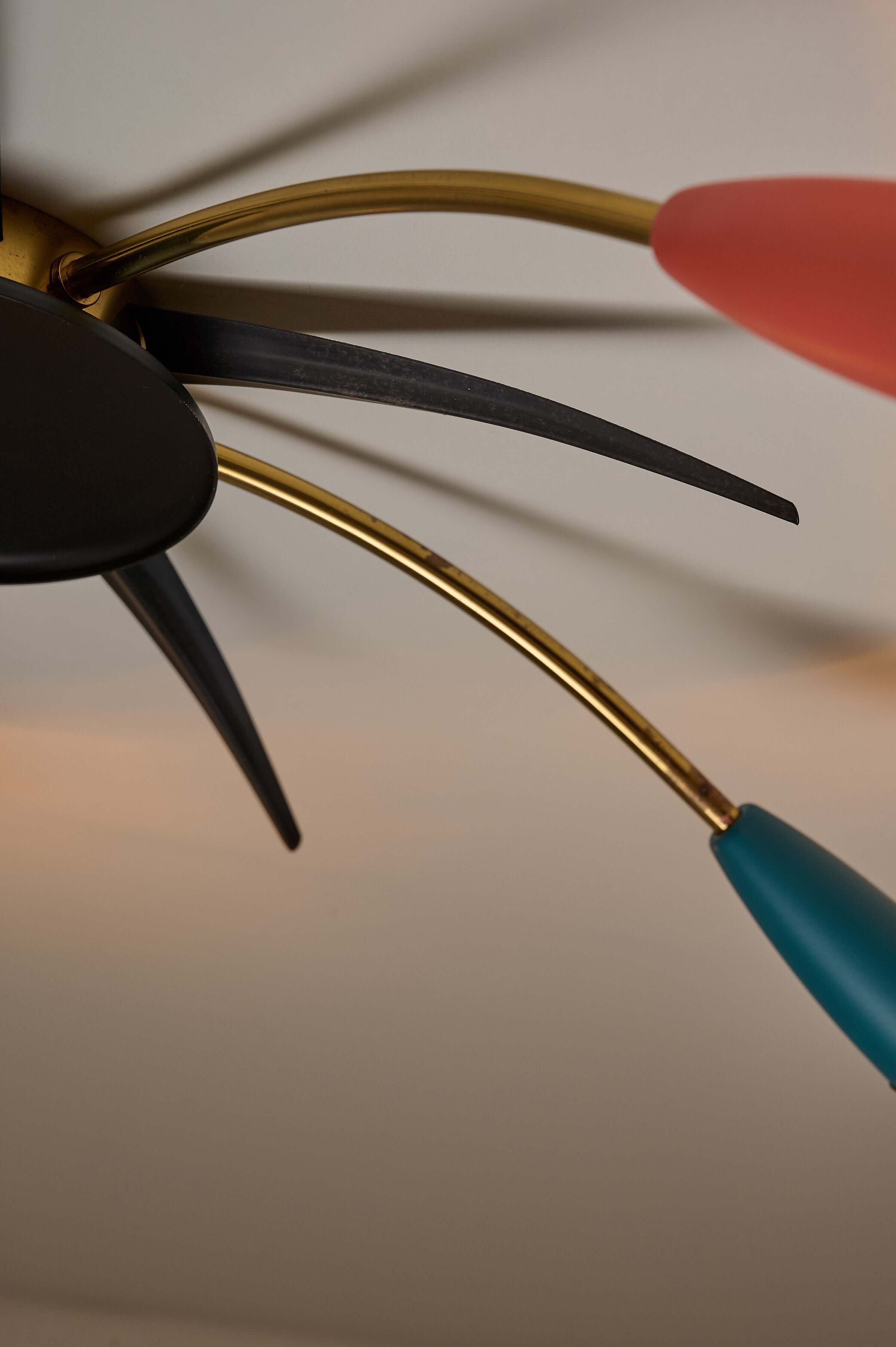 Close-up of the Mid-Century Multicolor Sputnik Ceiling Lamp showcasing colorful cone sockets and brass arms.