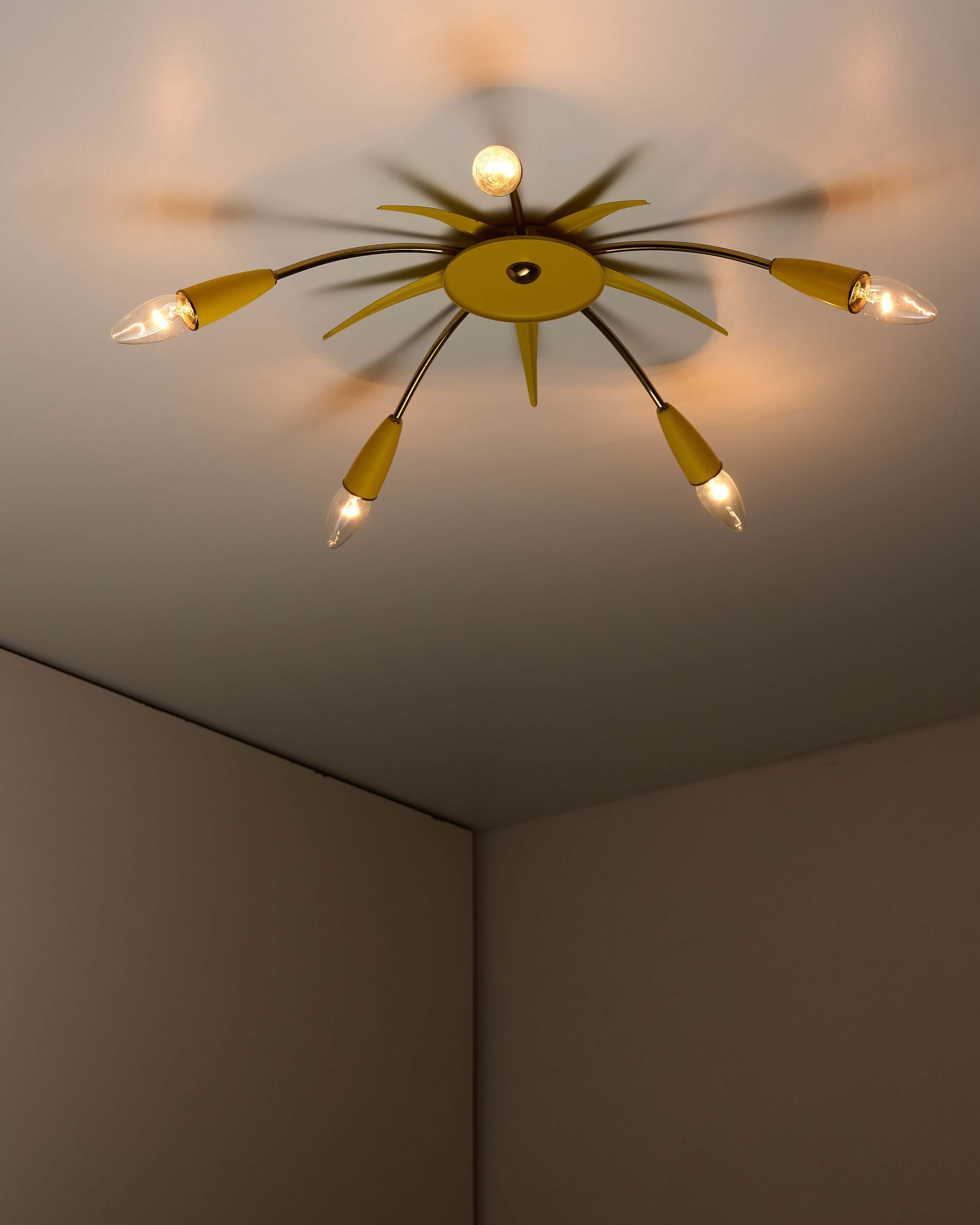 Mid-Century Yellow Sputnik Ceiling Lamp showcasing a 5-arm design with a yellow hub and brass accents.