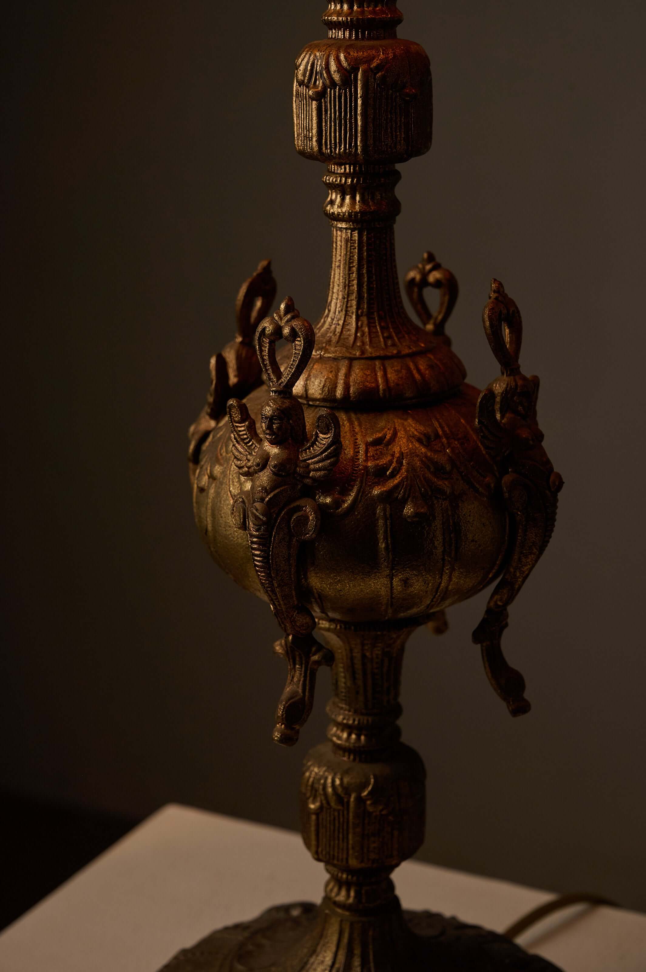 Cast Brass Table Lamp with Stitched Parchment Shade featuring intricate winged female figures and ornate base.