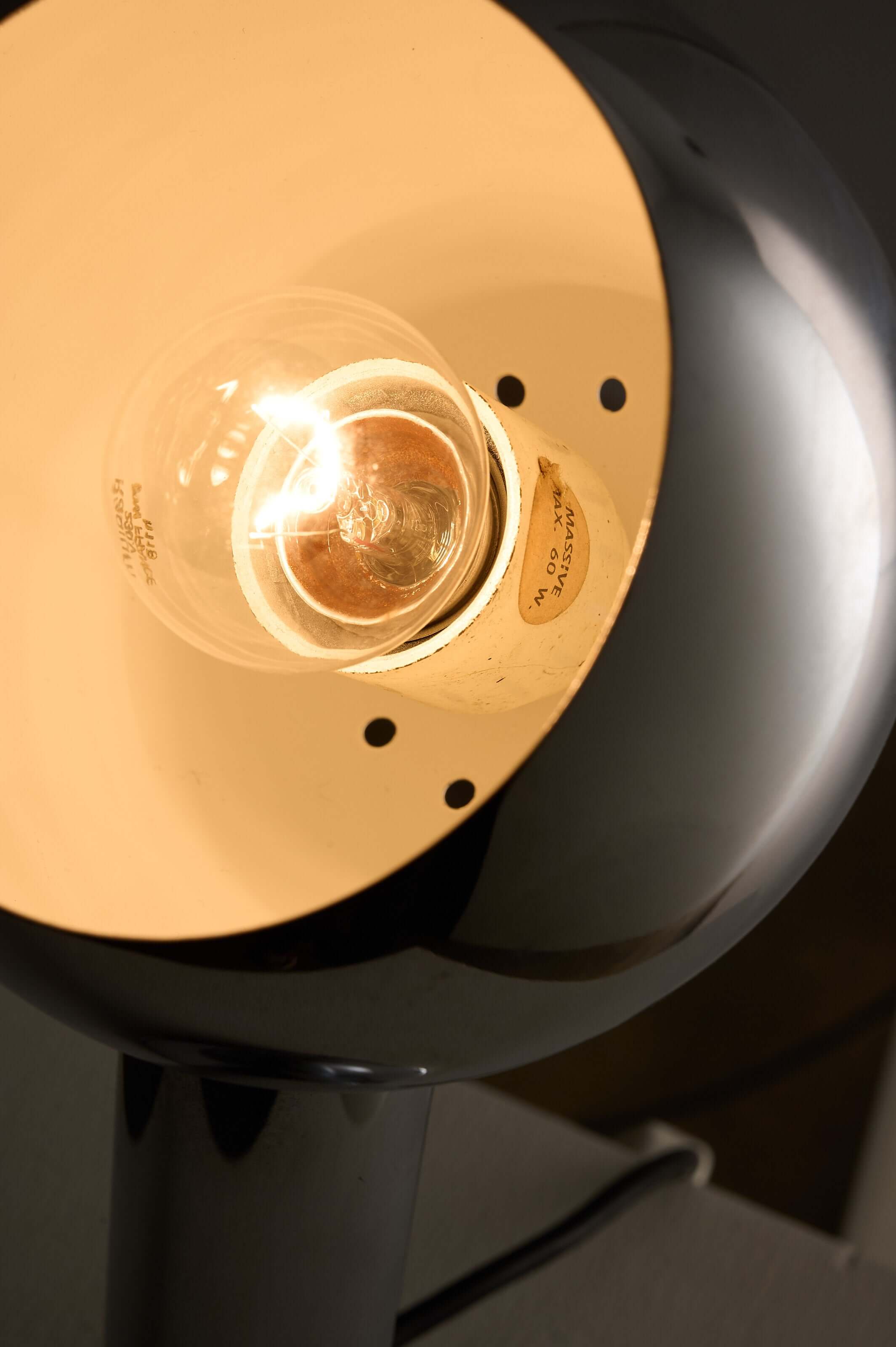 Close-up view of the Chrome 'Eyeball' Table Lamp by Massive showcasing the bulb and spherical chrome shade.