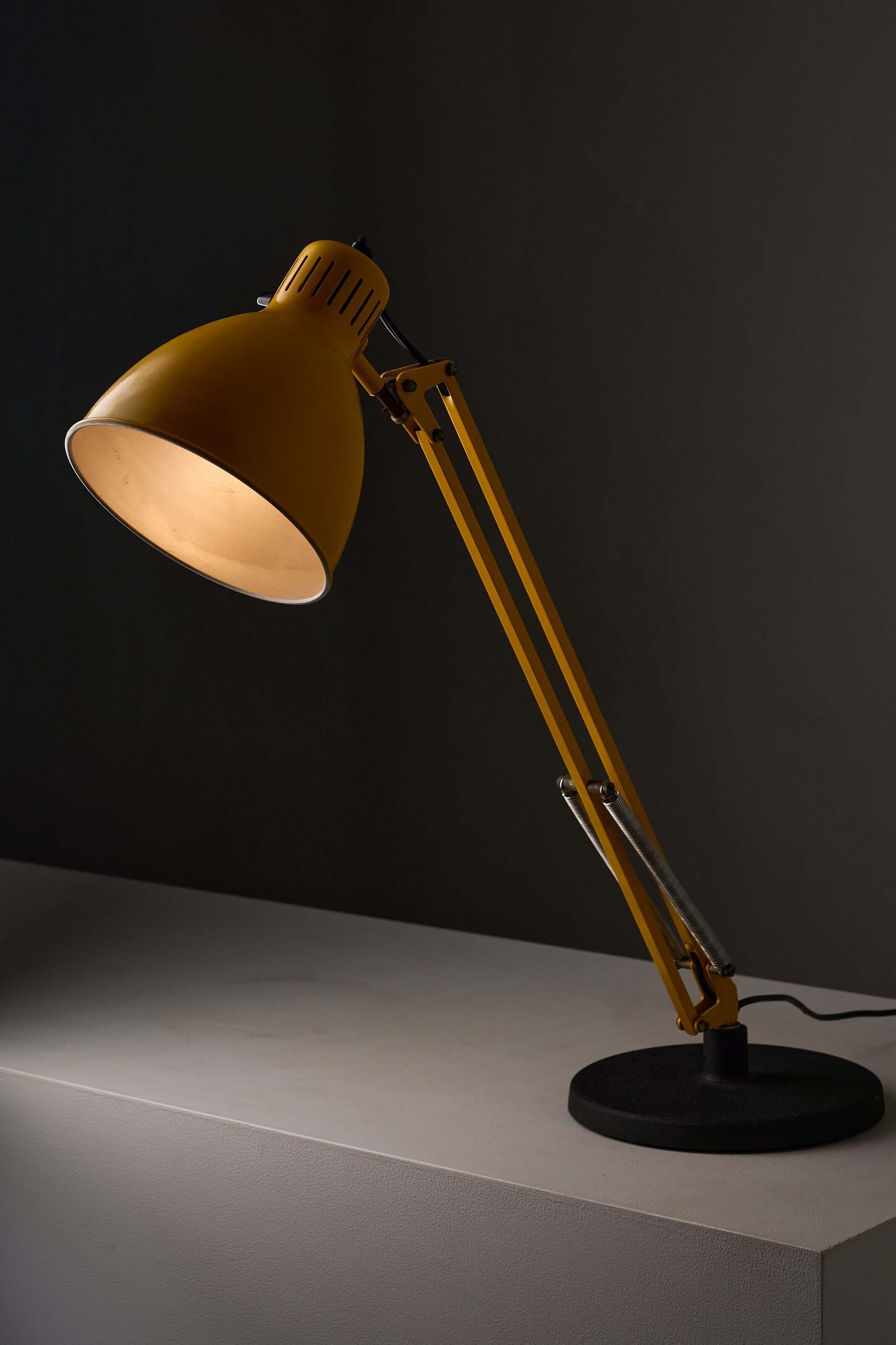 Yellow 'Arma' Desk Lamp by Metalarte with adjustable arm and black base, showcasing vintage design.
