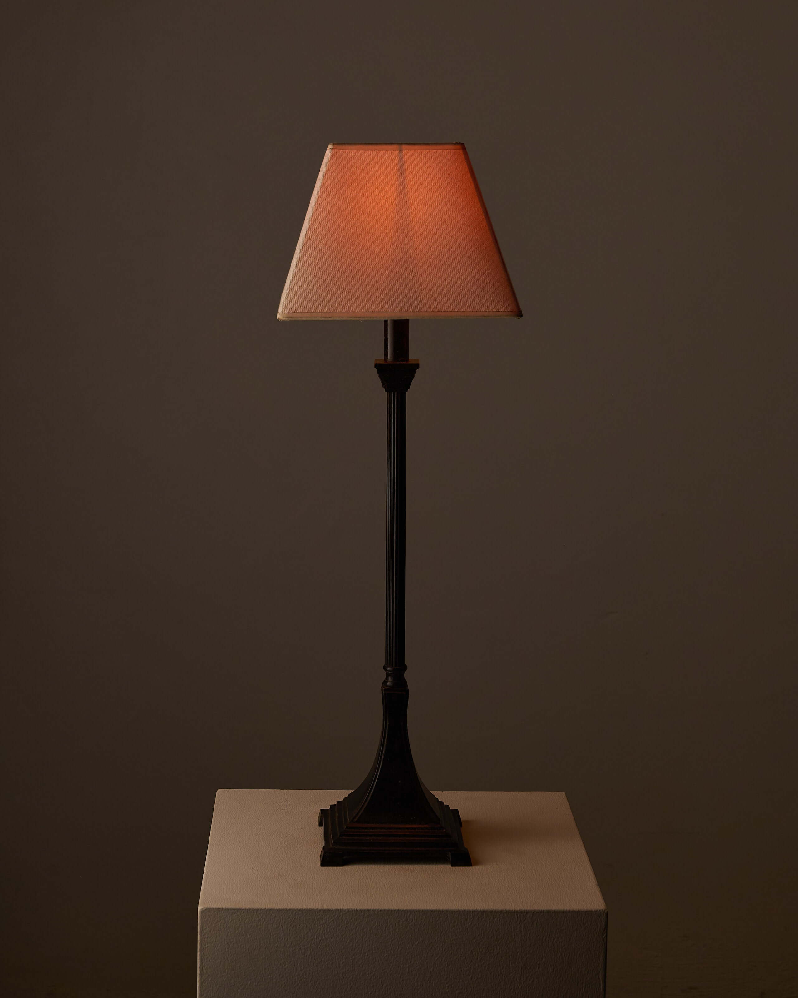 Neoclassical style metal table lamp with fabric shade, 1990s decor on display against a neutral background.