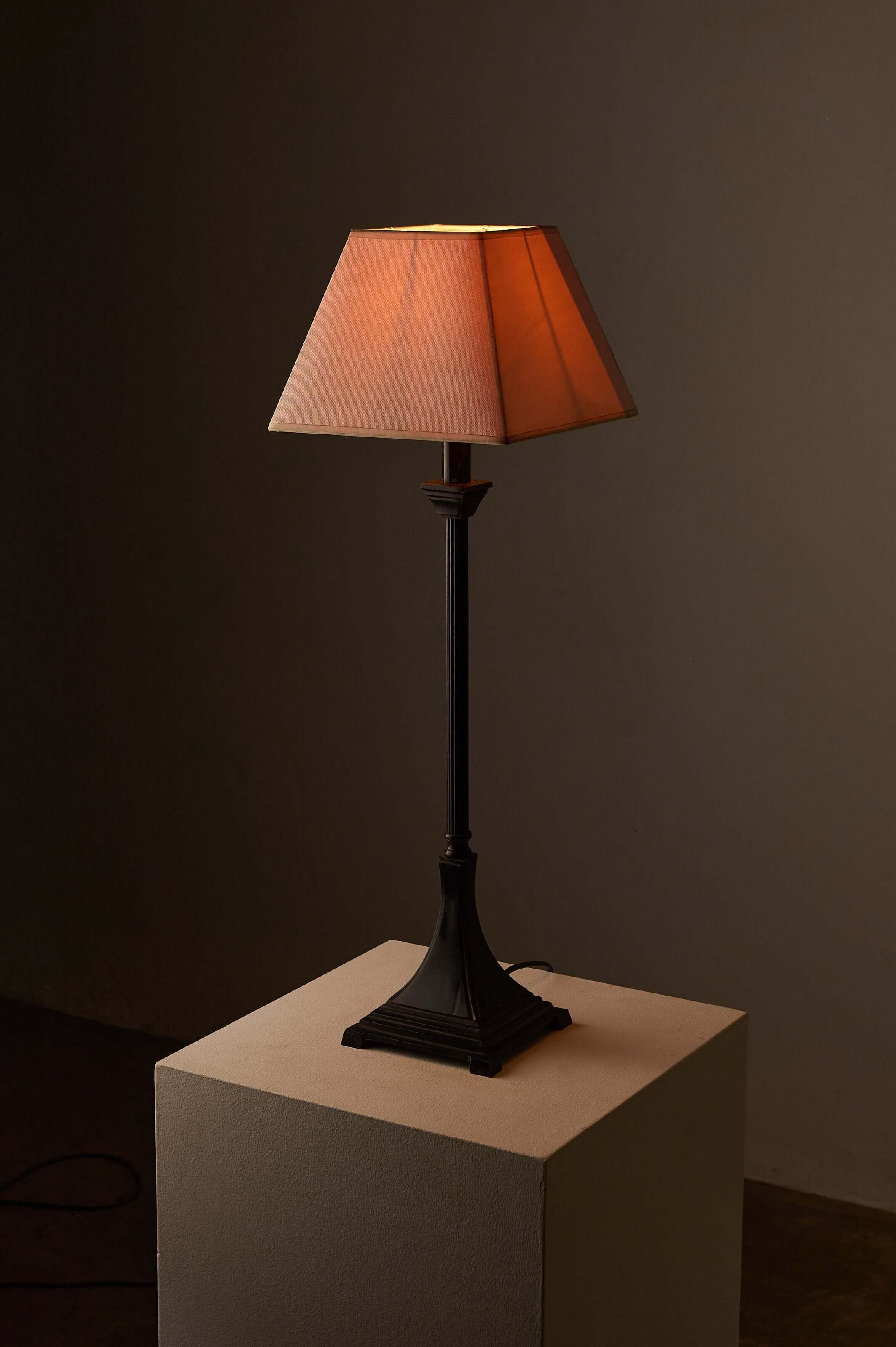 Neoclassical metal table lamp with fabric shade on a pedestal, showcasing a timeless design from the 1990s.