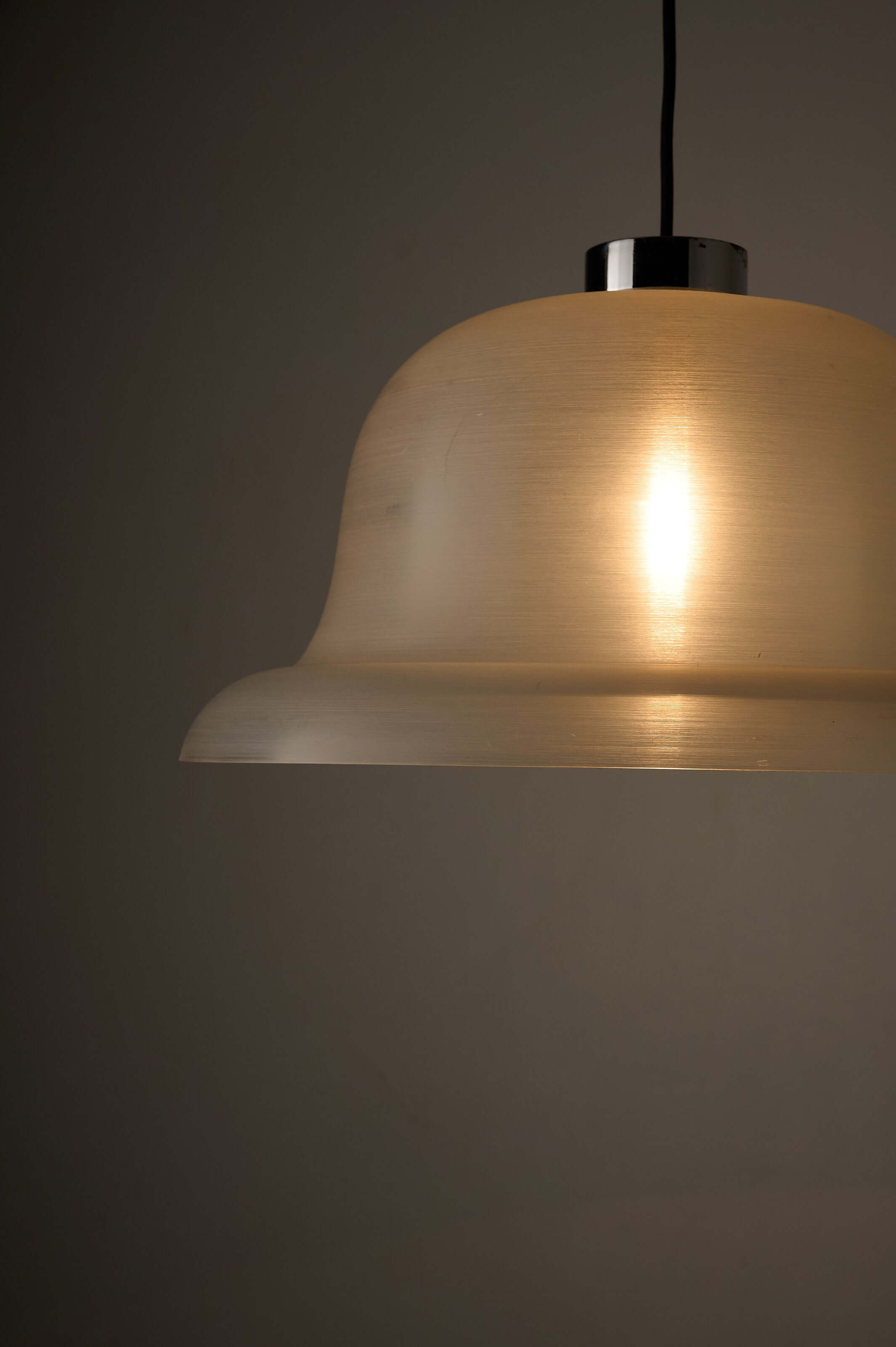 Translucent Acrylic Bell Pendant Lamp, 1970s hanging from a polished chrome cap, emitting a soft glow.