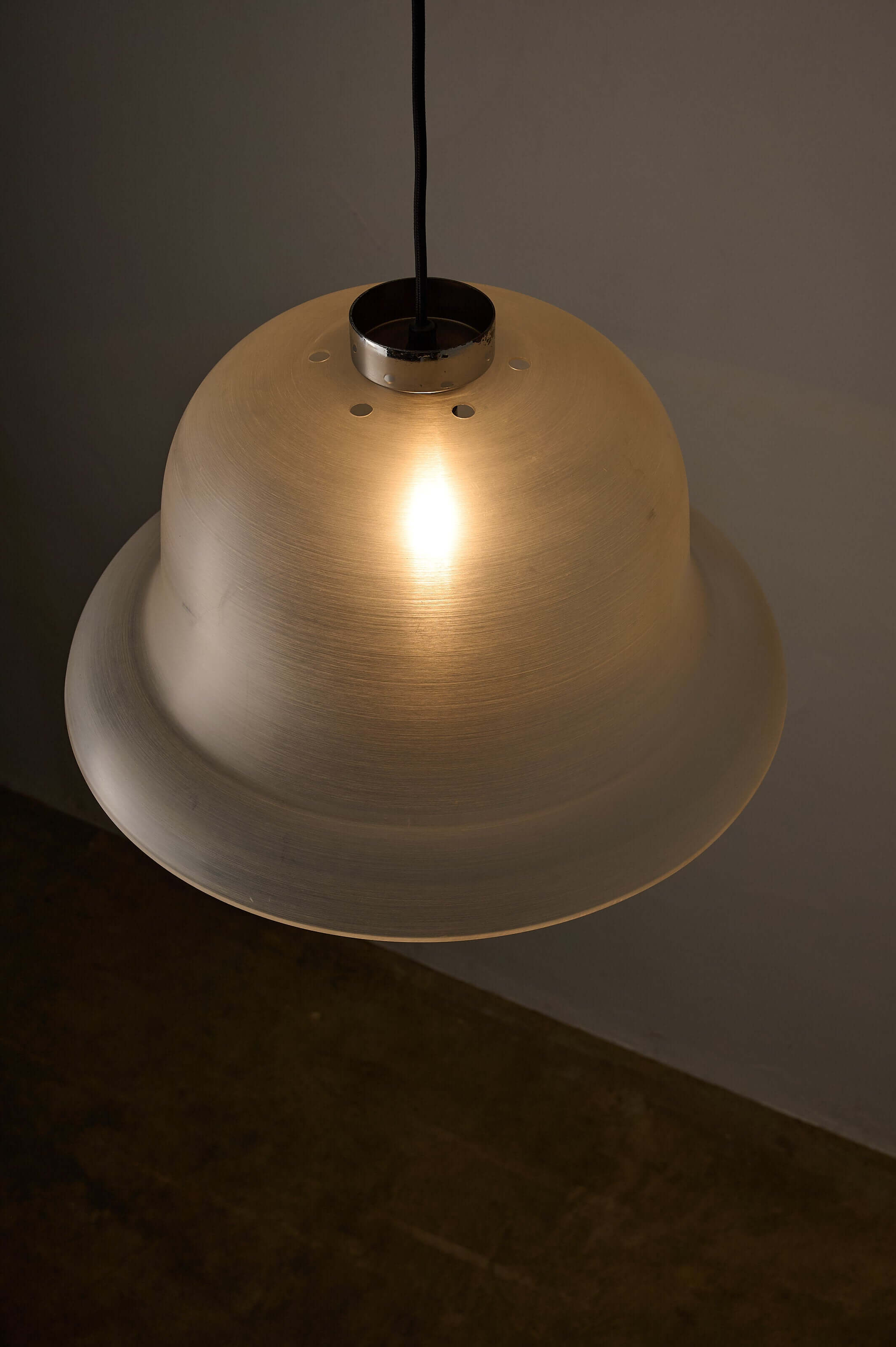 Translucent Acrylic Bell Pendant Lamp, 1970s hanging above a dark background, showcasing its textured shade.