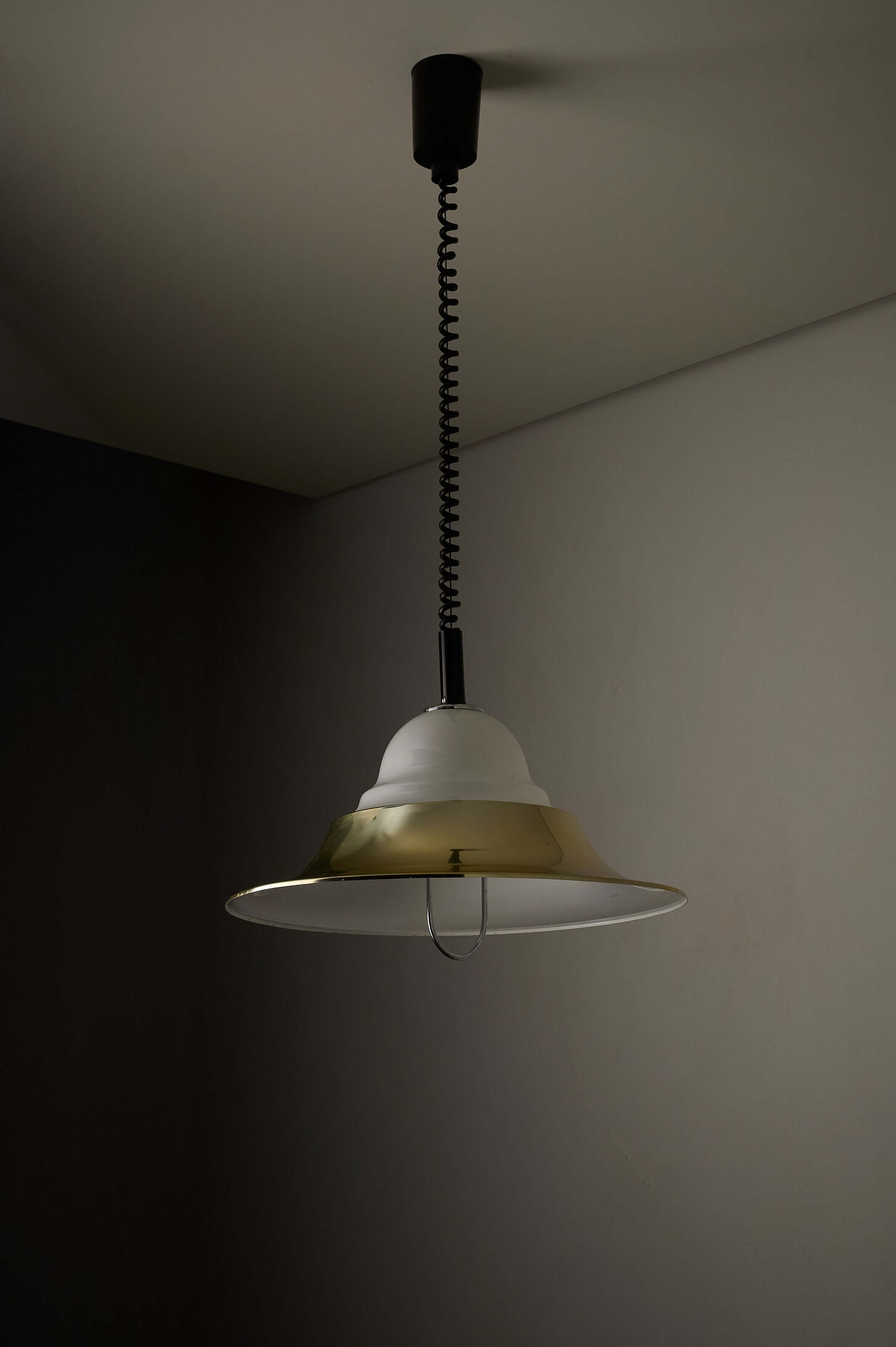Brass and Opal Glass Model 7565 Pendant Lamp by Cosack hanging from a ceiling with a flexible cord design.