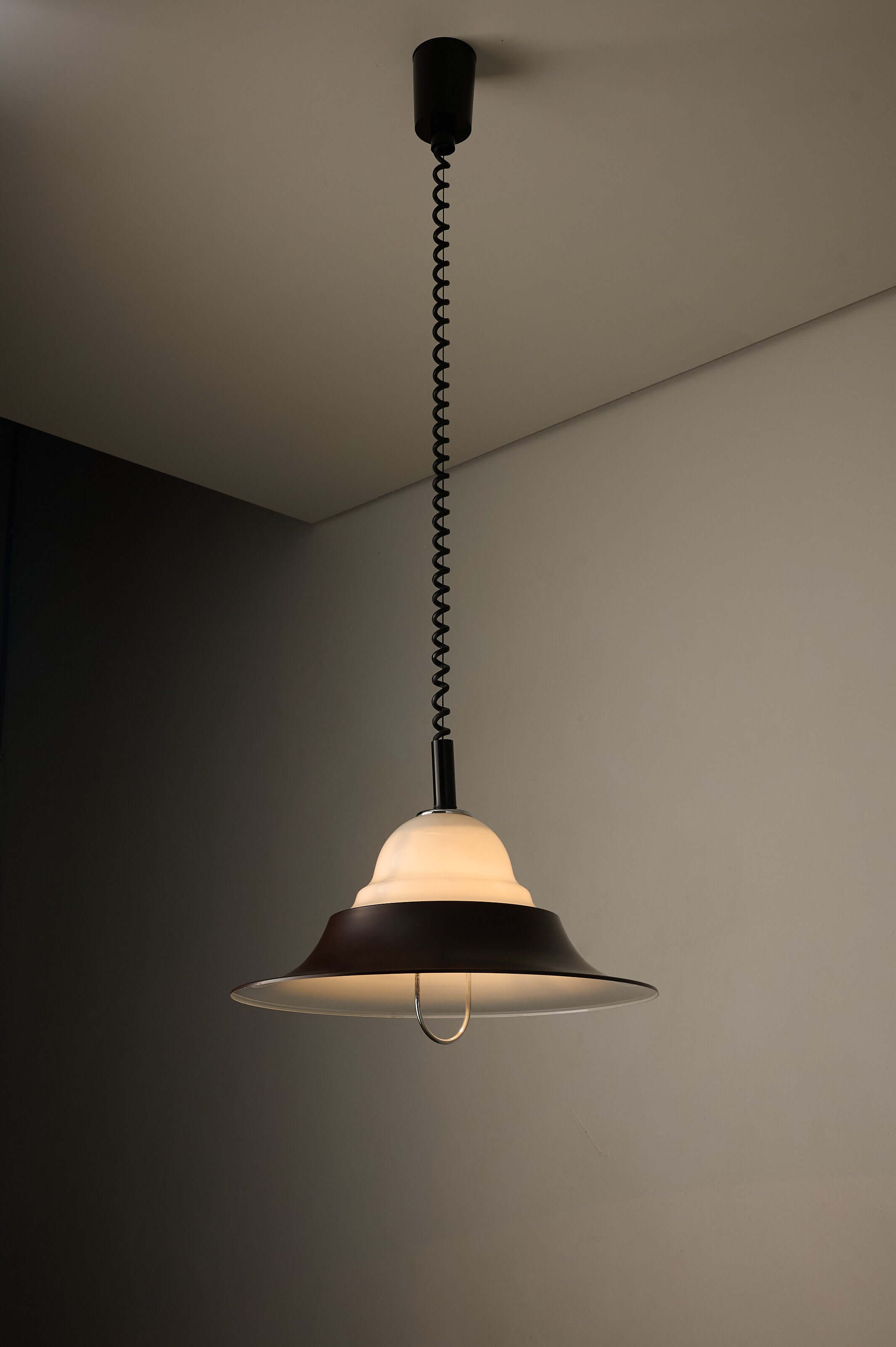 Brown and Opal Glass Model 7565 Adjustable Pull-Down Lamp by Cosack hanging from a black spiral cable.