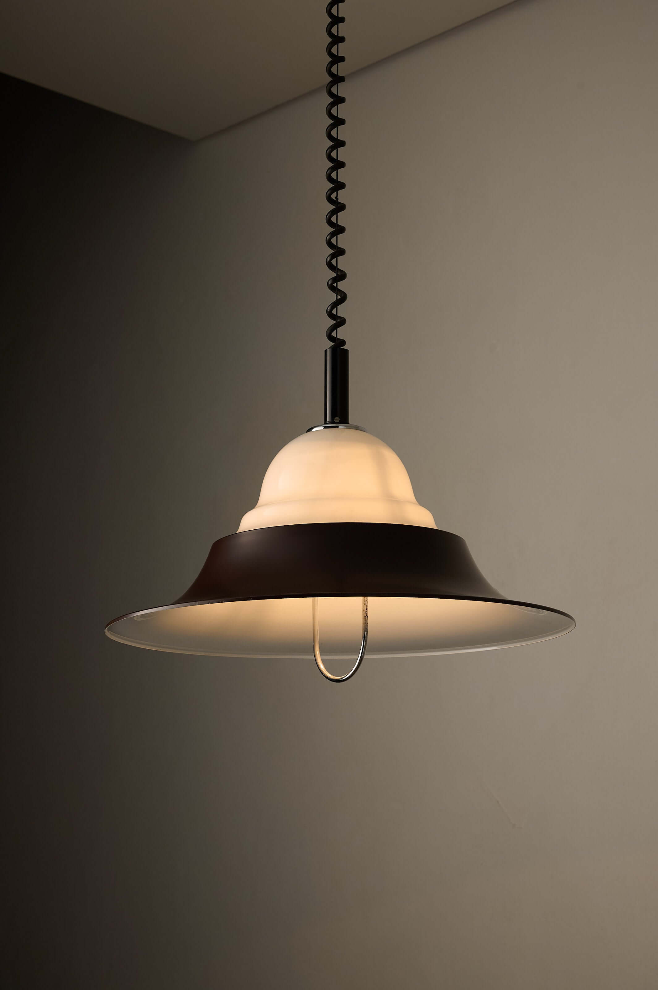 Brown and Opal Glass Model 7565 Adjustable Pull-Down Lamp by Cosack hanging from a black spiral cable.