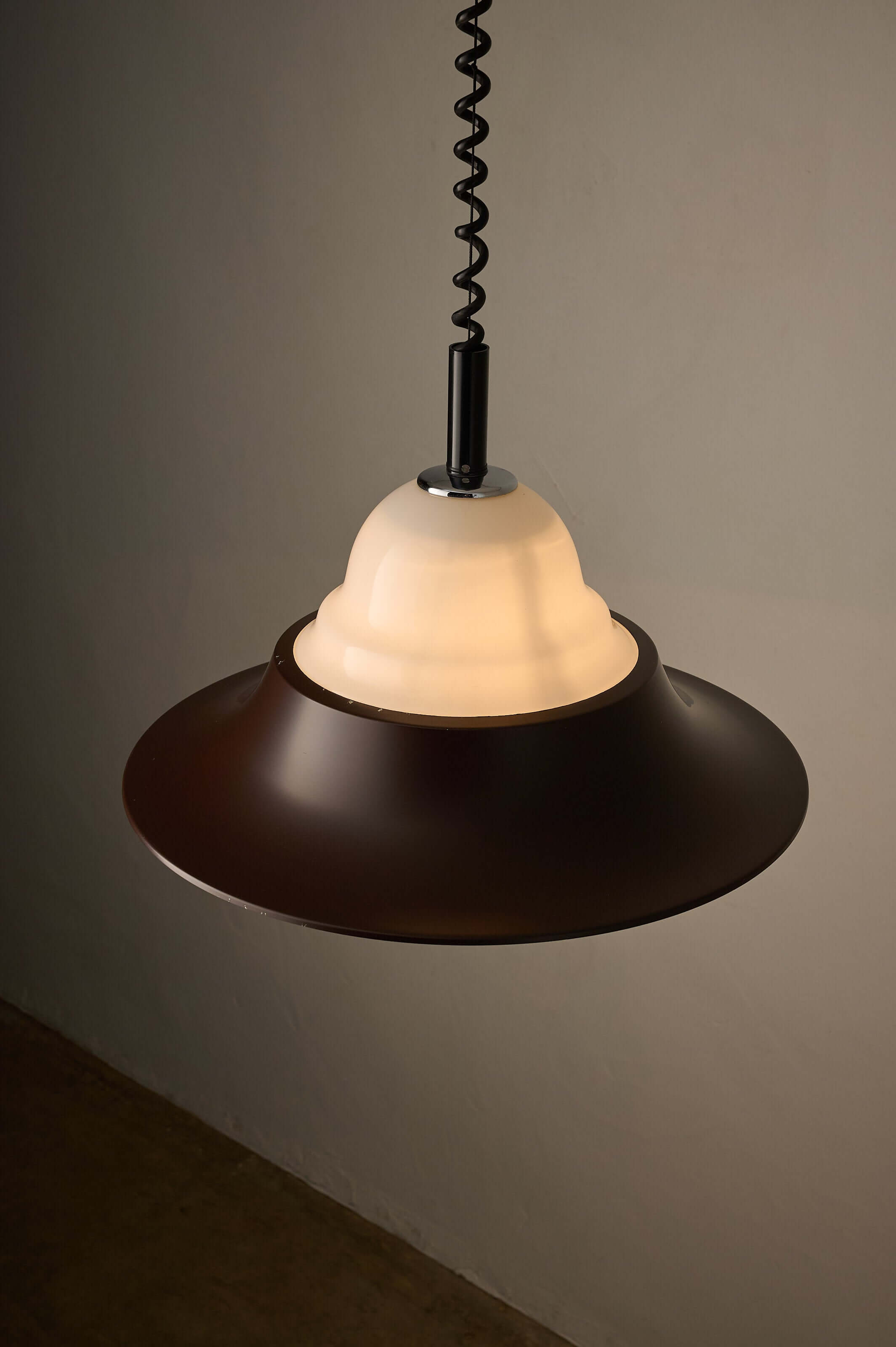 Brown and Opal Glass Model 7565 Adjustable Pull-Down Lamp by Cosack hanging from a spiral cable.