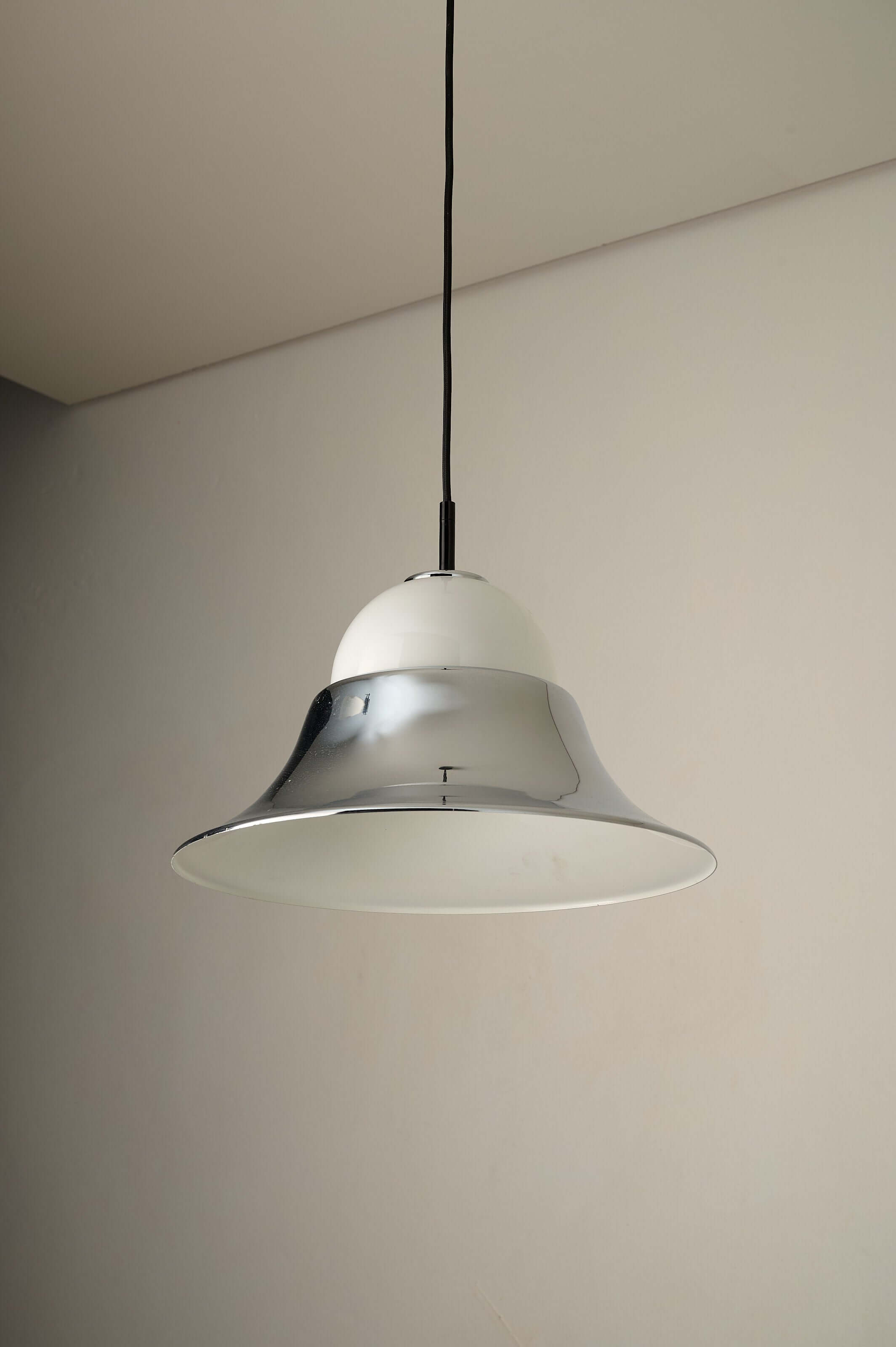 Chrome and Opal Glass Model 7563 Pendant by Cosack hanging from a ceiling, showcasing its polished chrome and opal glass design.