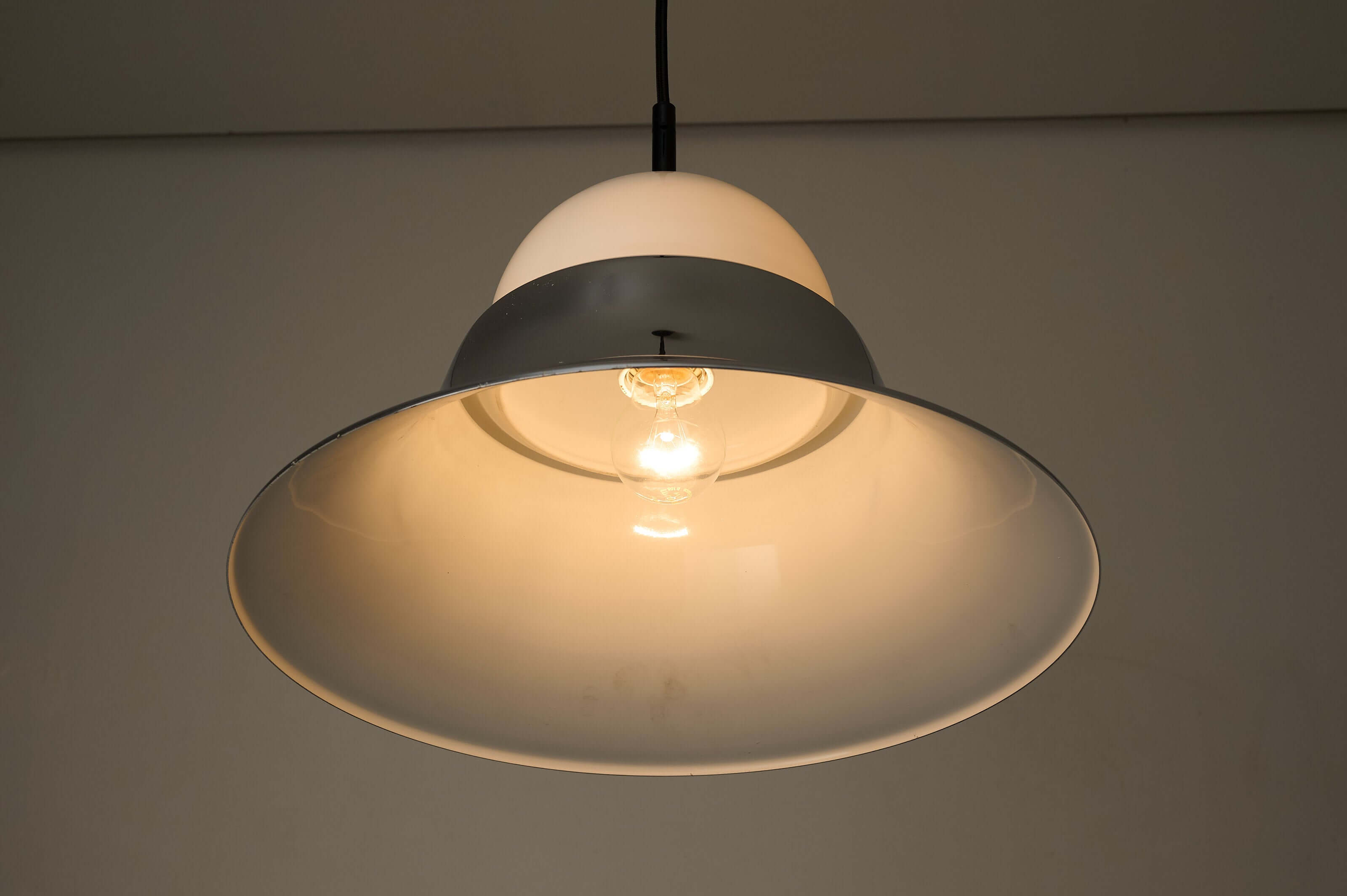 Chrome and Opal Glass Model 7563 Pendant by Cosack illuminating a soft ambient glow.