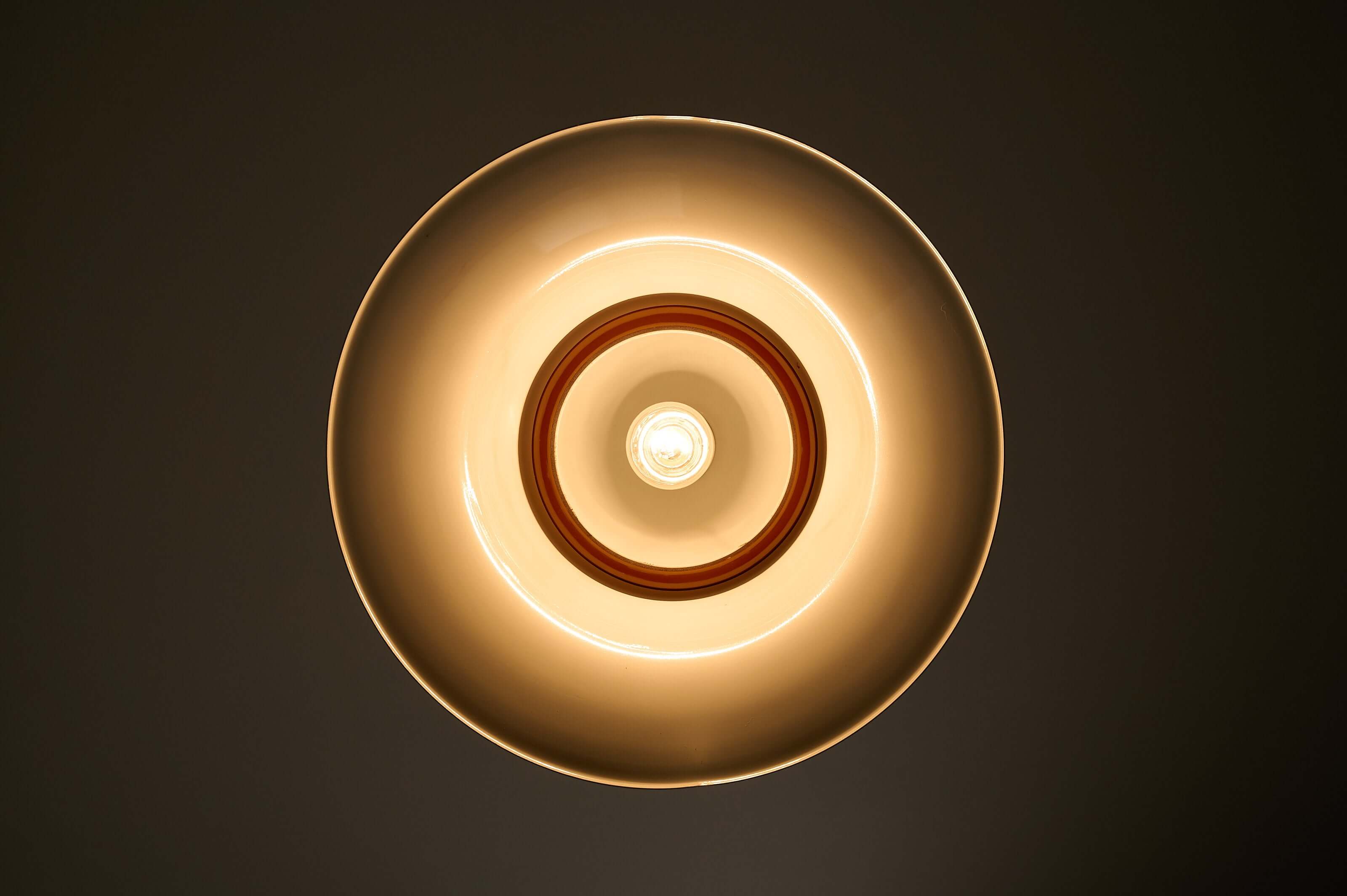 Brass and Amber Glass Model 7563 Pendant by Cosack viewed from below, showcasing its warm glow and elegant design.