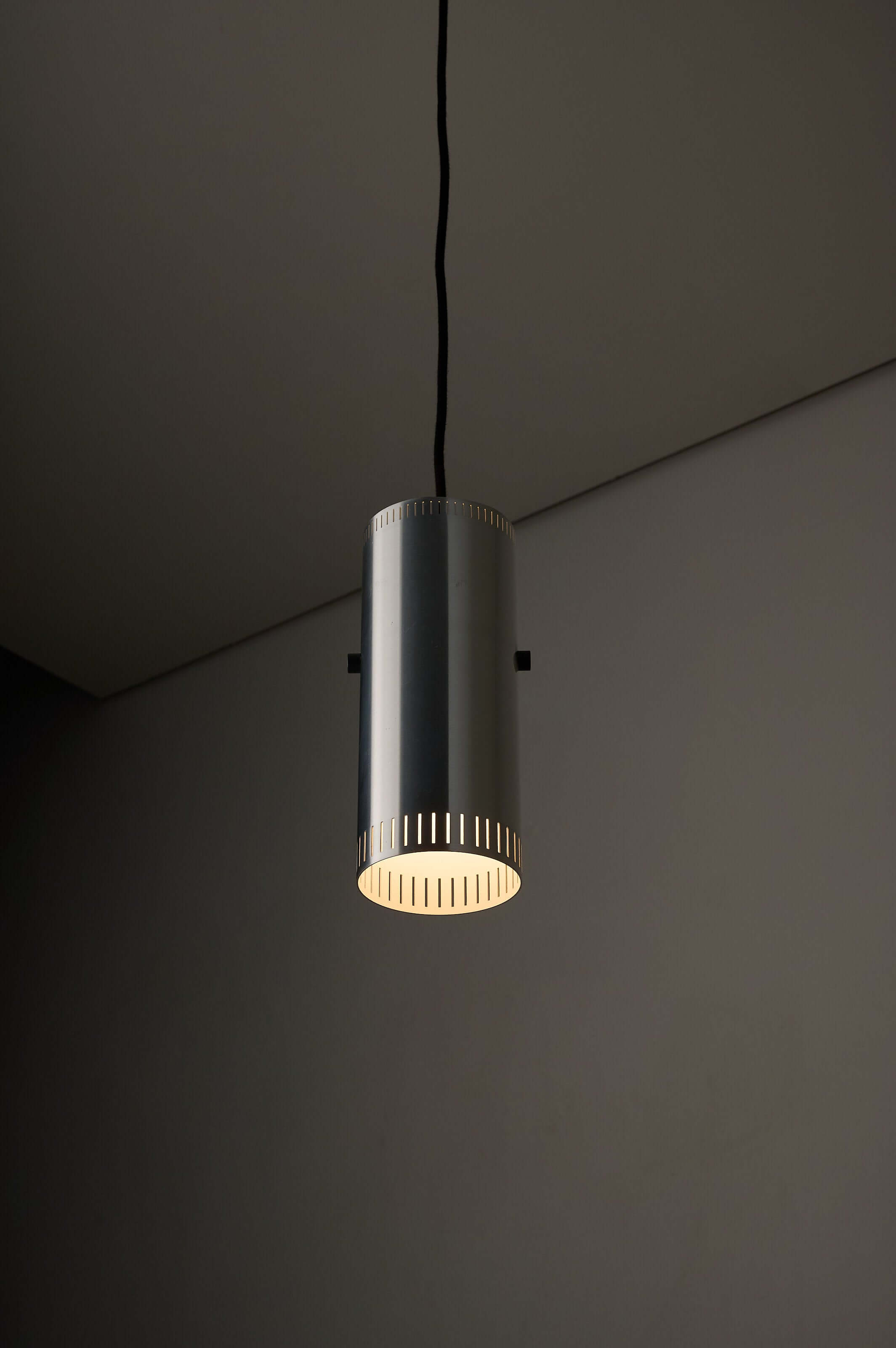 Aluminium "Cylindre" Pendant by Jo Hammerborg for Fog & Mørup, 1960s hanging in minimalistic setting.