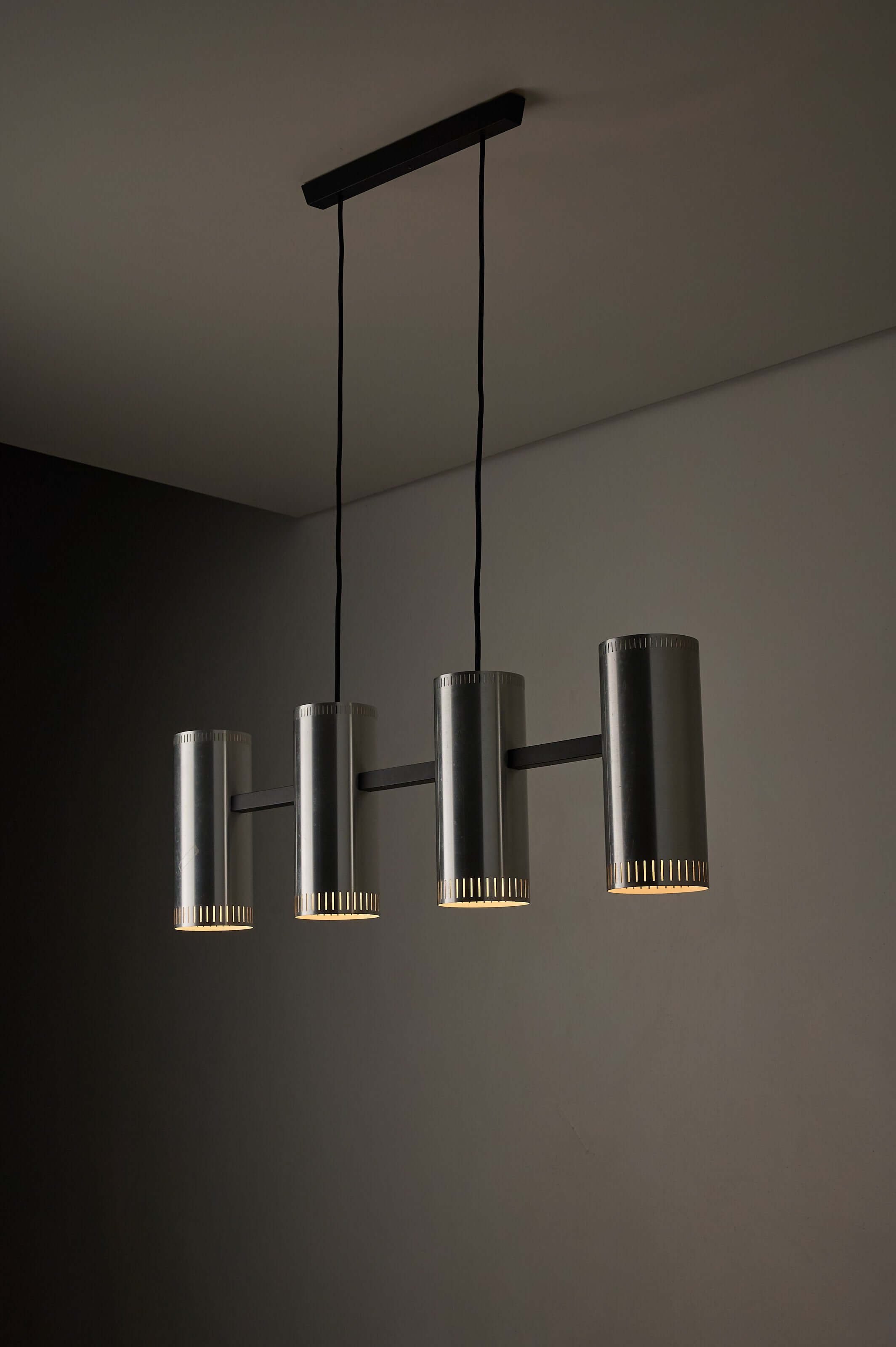 Aluminium "Cylindre IV" 4-Light Linear Pendant by Jo Hammerborg for Fog & Mørup, 1960 in a modern interior.
