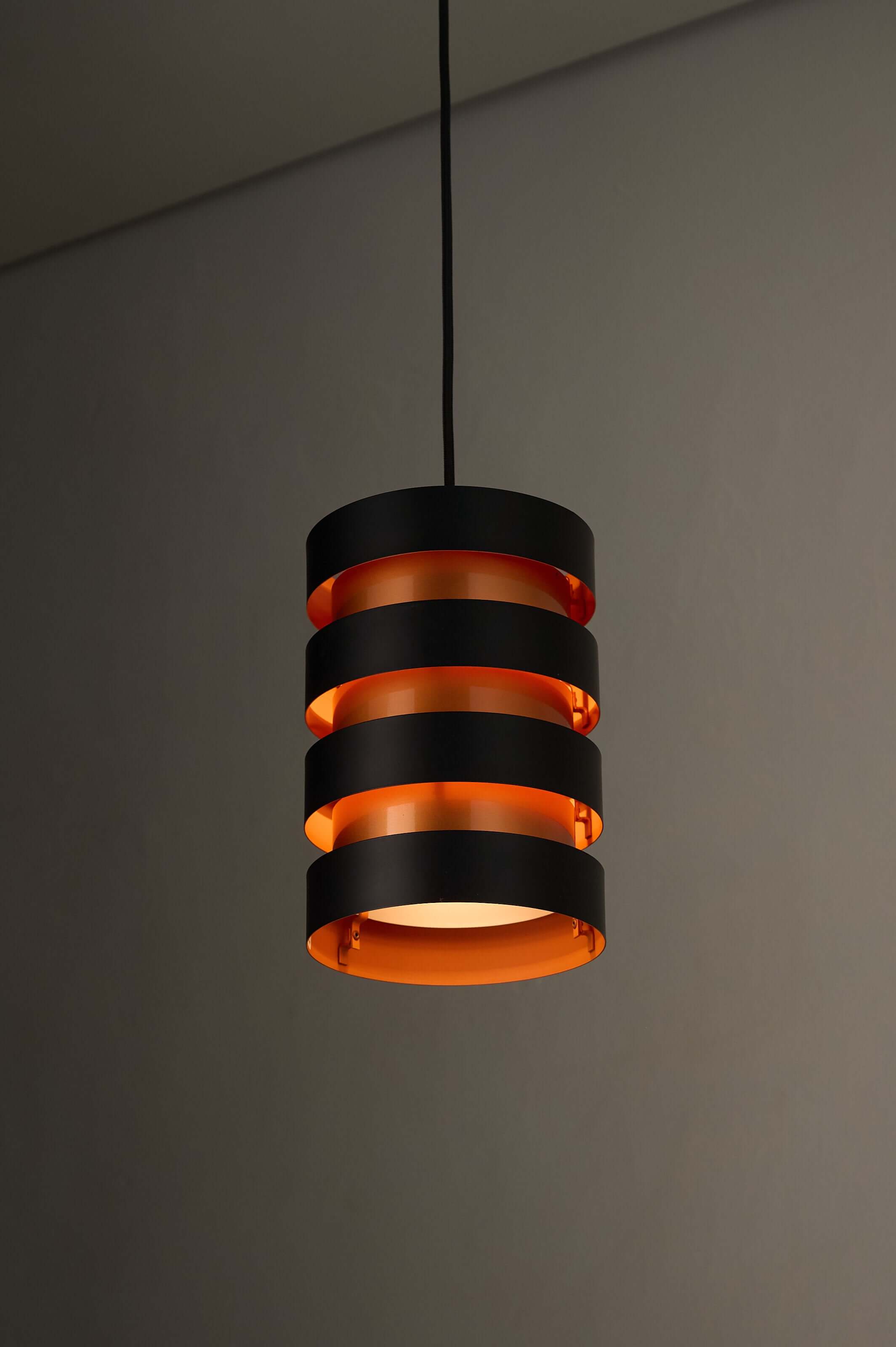 Black and Copper "Eiffel" Pendant by Jo Hammerborg for Fog & Mørup, showcasing a modern design with warm ambient light.