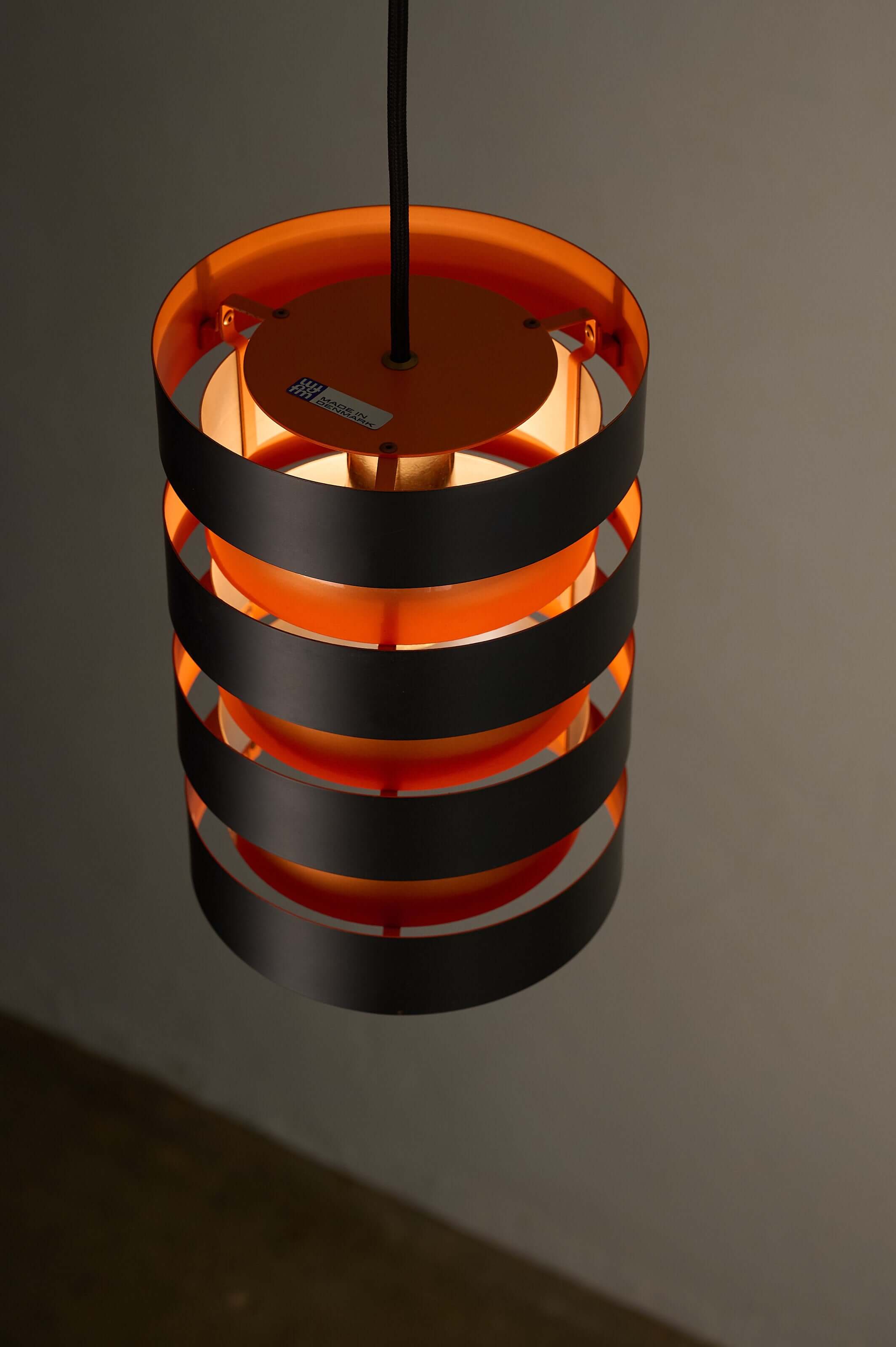 Black and Copper "Eiffel" Pendant by Jo Hammerborg for Fog & Mørup hanging lamp with vibrant orange interior.