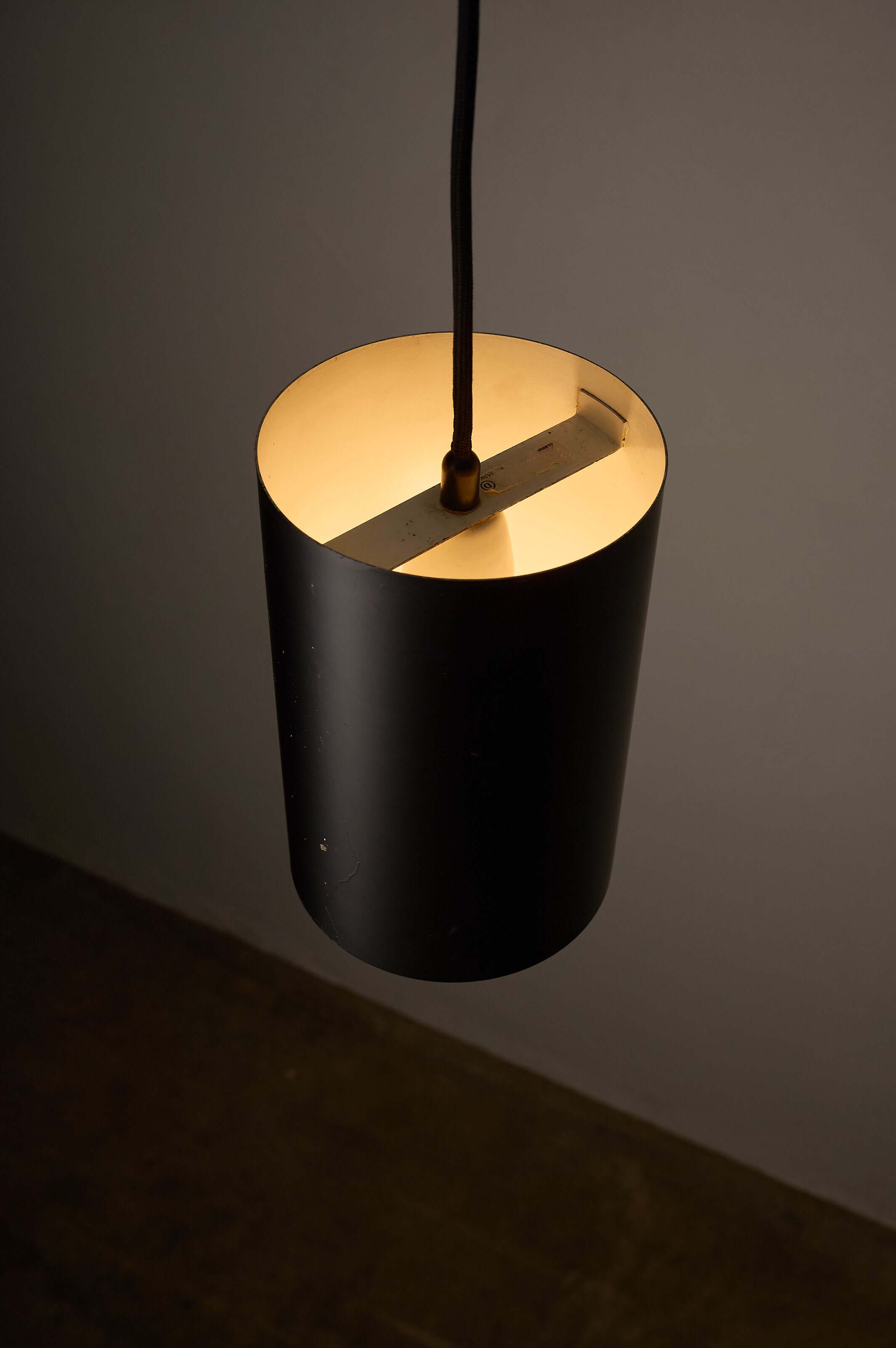 Minimalist Black Cylinder Pendant by Fog & Mørup, 1960s hanging lamp with matte black finish and white interior.