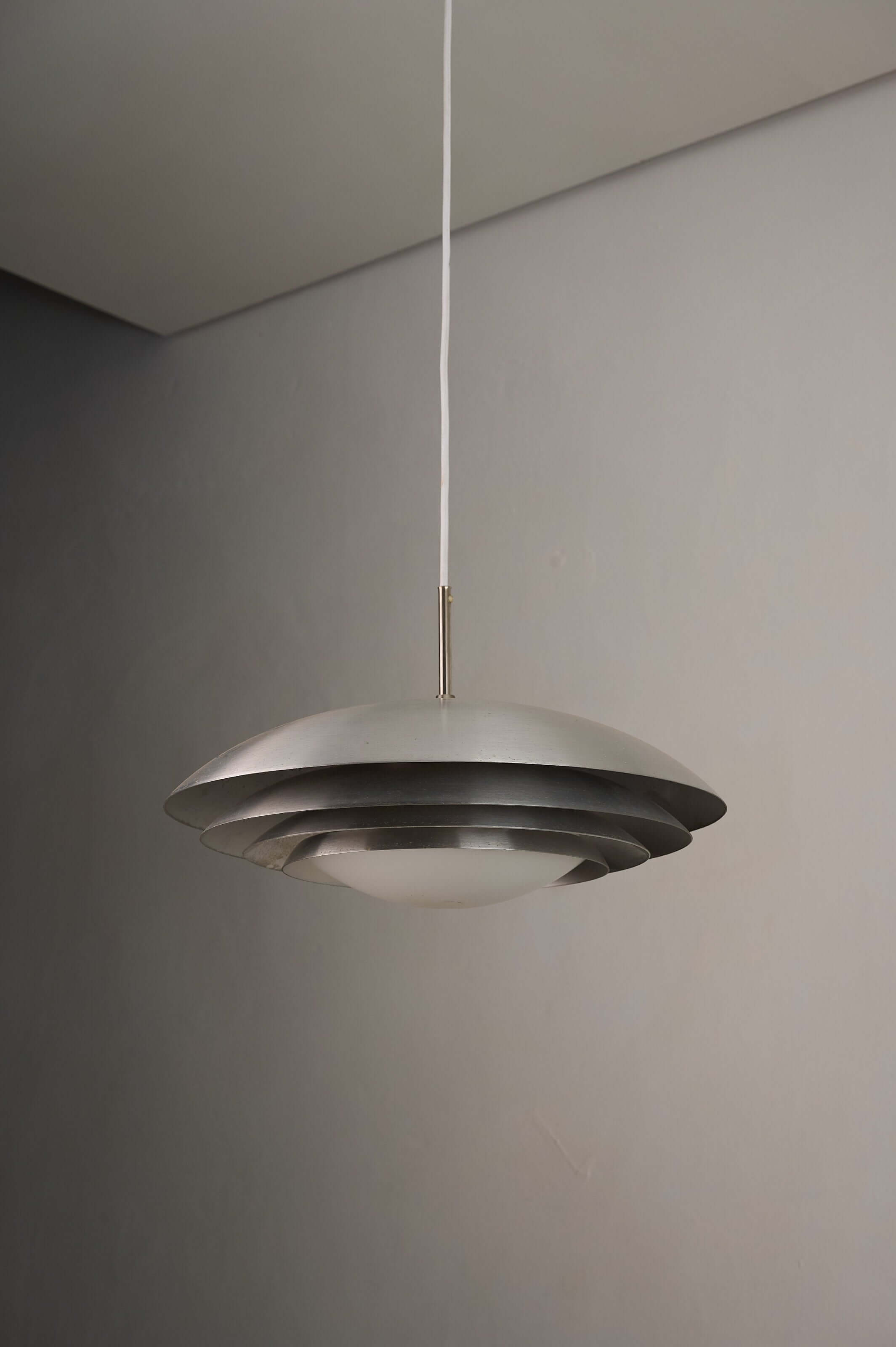 German Space Age "UFO" Pendant in Aluminium and Opal Glass by B+L Leuchten featuring satin-finish dome and brushed aluminium rings.