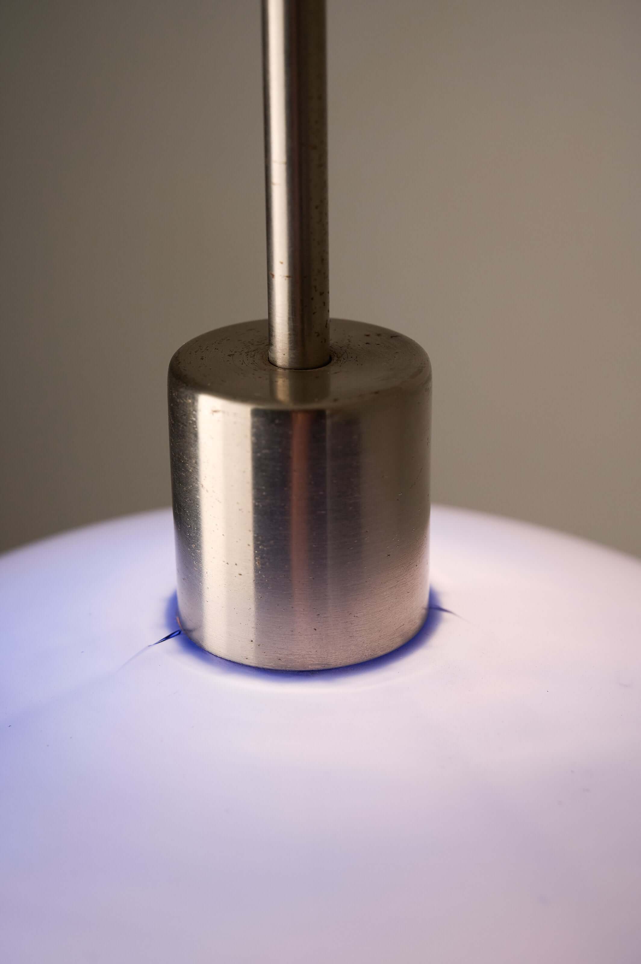 Azure Blue Opaline Glass Pendant with Metal Stem showcasing the sleek metal stem and illuminated shade.
