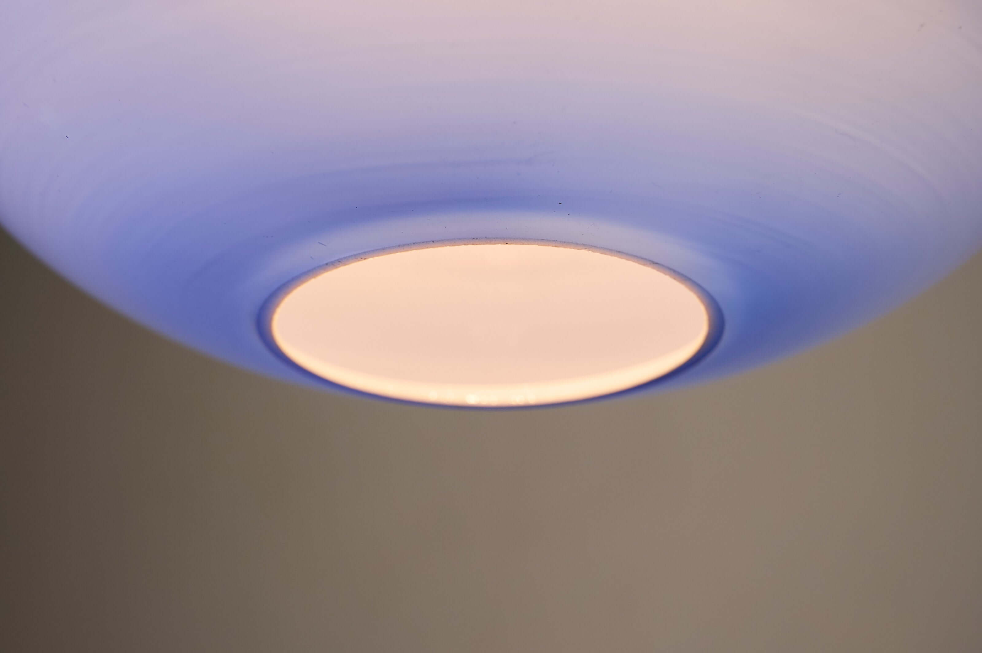 Azure Blue Opaline Glass Pendant with Metal Stem showcasing the voluminous shade's blue ombre effect.