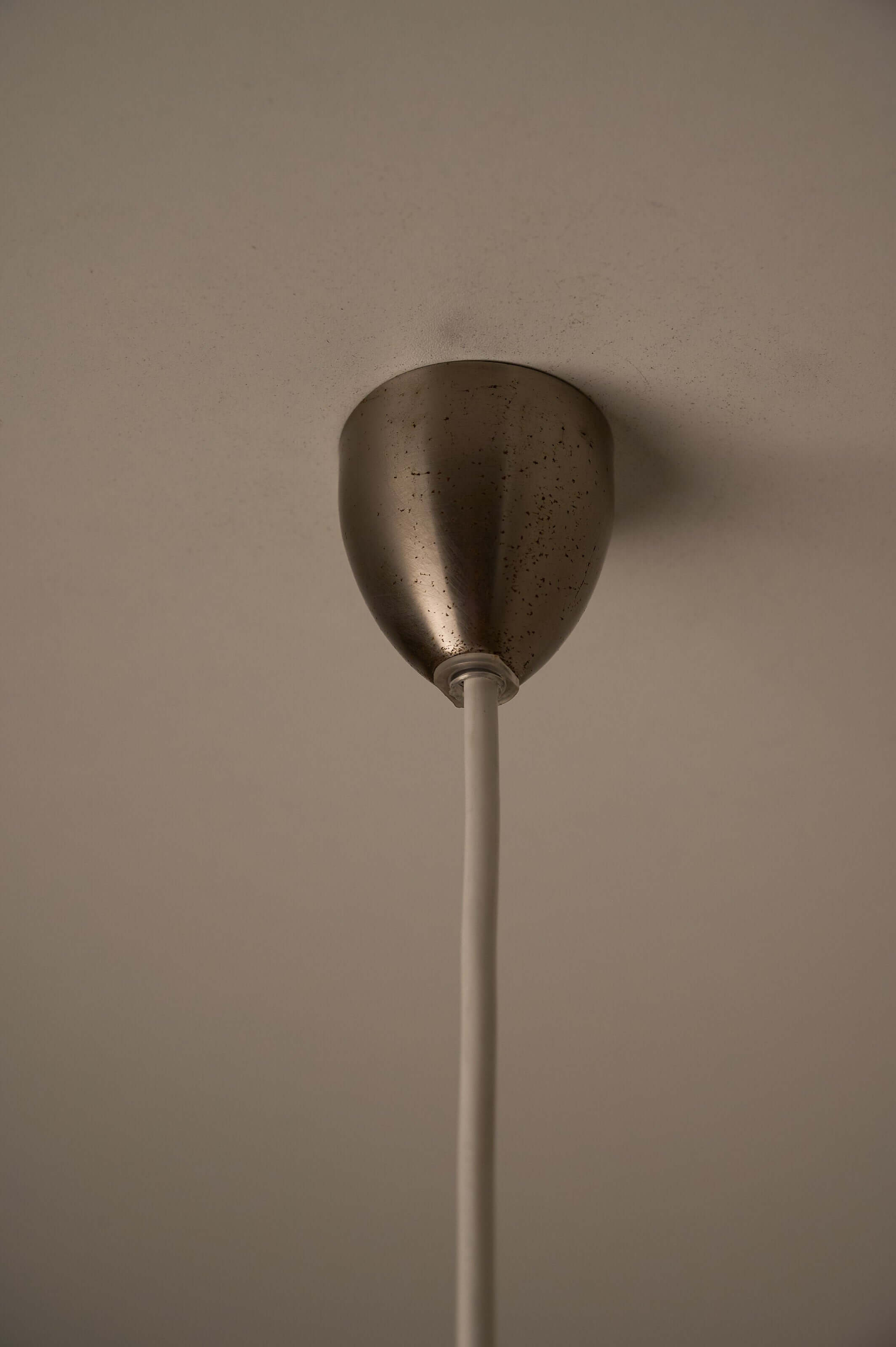 Ceiling mount for Azure Blue Opaline Glass Pendant with Metal Stem, showcasing metal stem and white hanging cord.