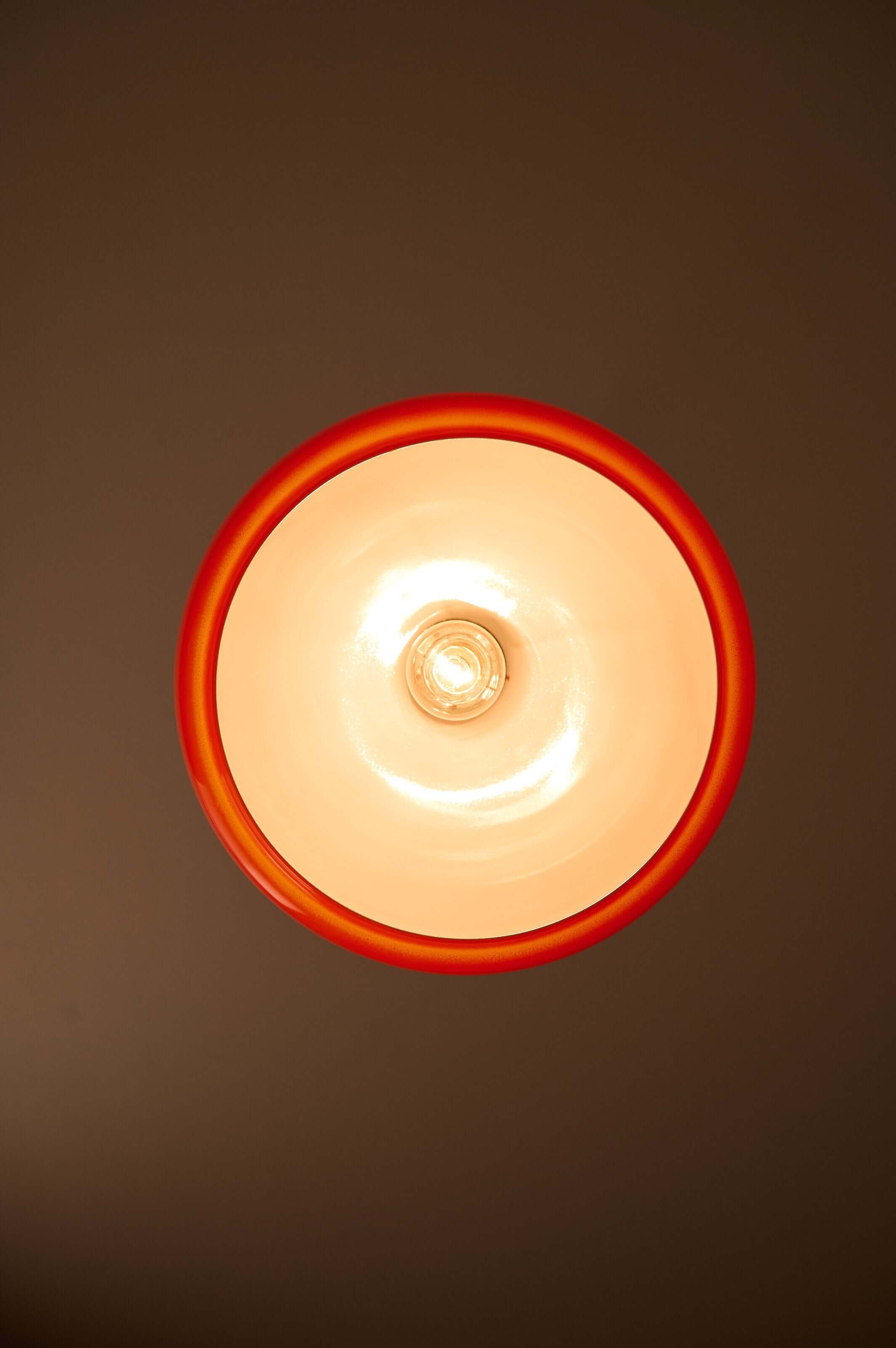 Orange Opaline Glass Pendant by Fog & Mørup viewed from below, showcasing its vibrant tangerine and opal design.