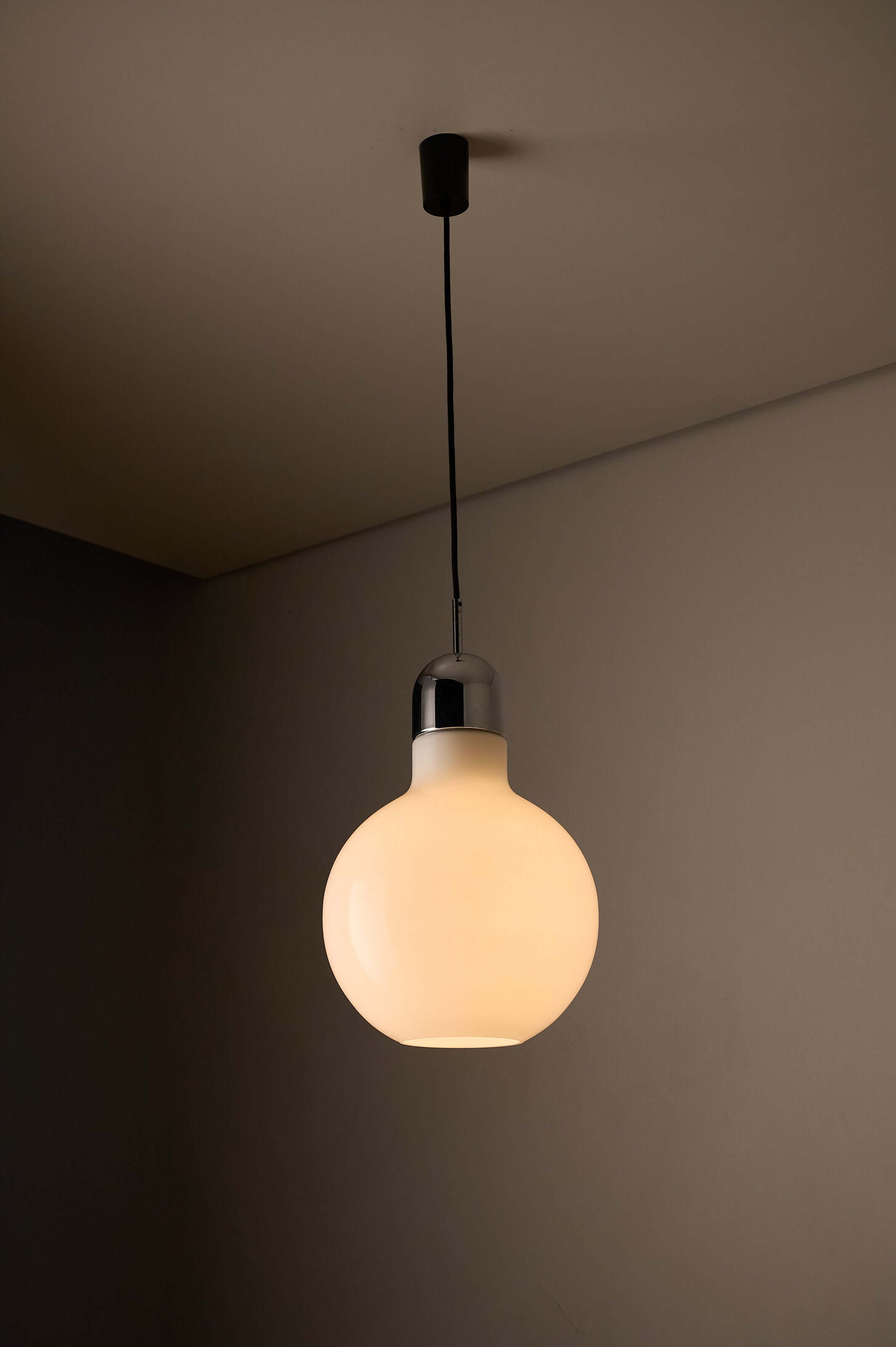 Large Opal Glass & Chrome Pendant by Cosack hanging from the ceiling, showcasing a bulbous opaline shade and chrome cap.