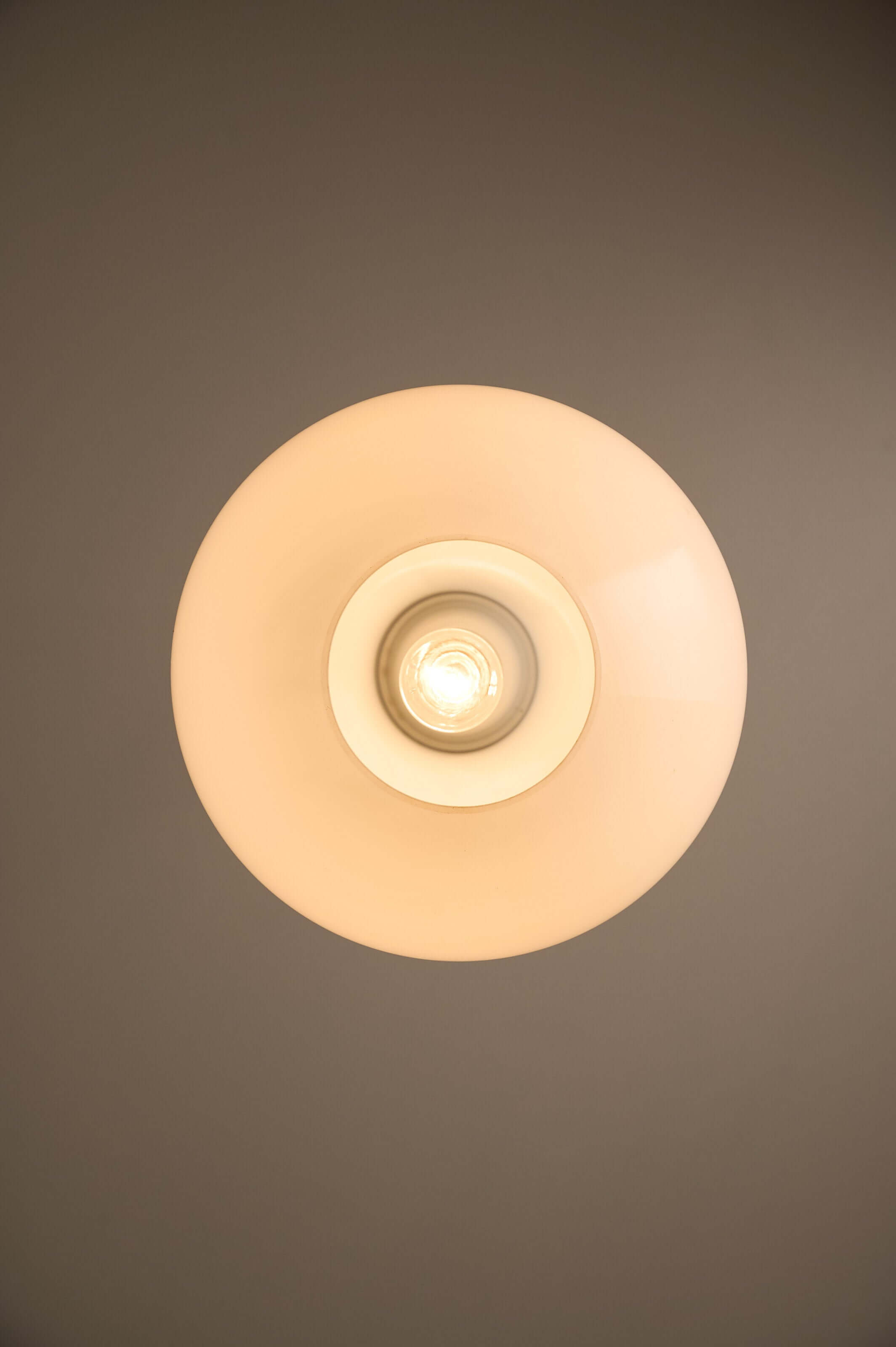 Large Opal Glass & Chrome Pendant by Cosack illuminated from below, showcasing its elegant bulbous silhouette.