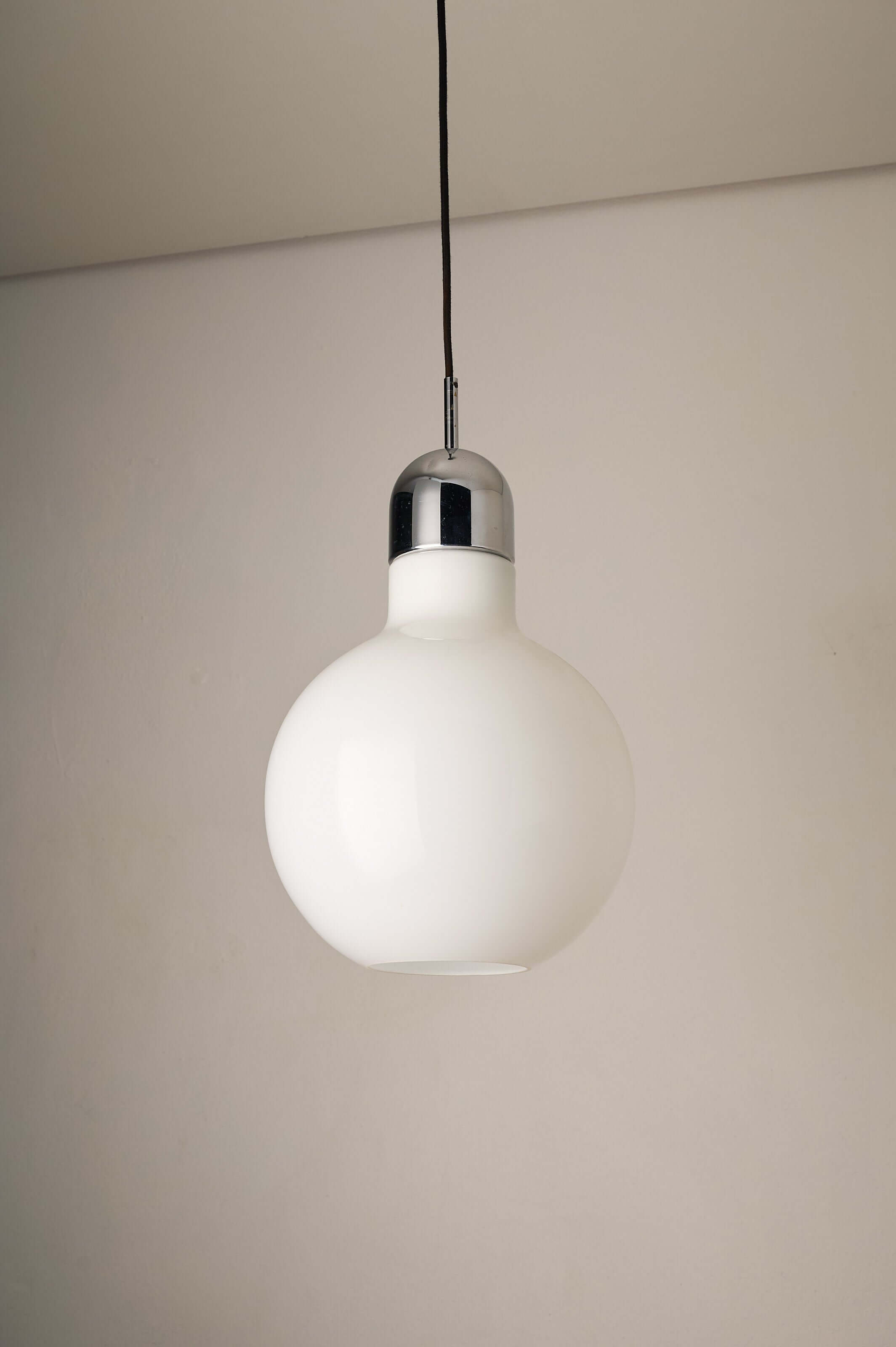 Large Opal Glass & Chrome Pendant by Cosack hanging from the ceiling, showcasing its bulbous shape and chrome finish.