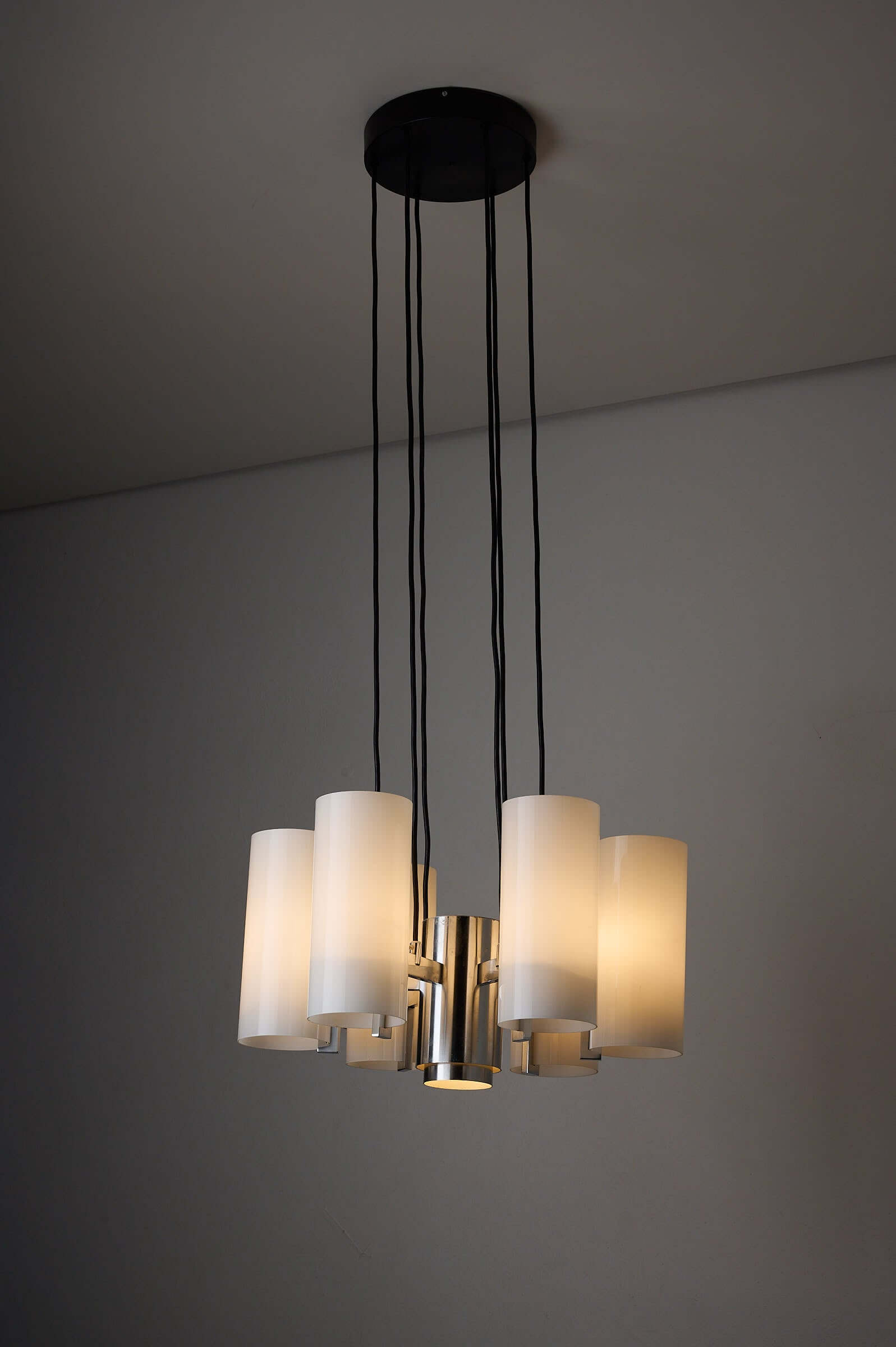 Space Age chrome chandelier with six cylindrical opaline glass shades and polished chrome arms.