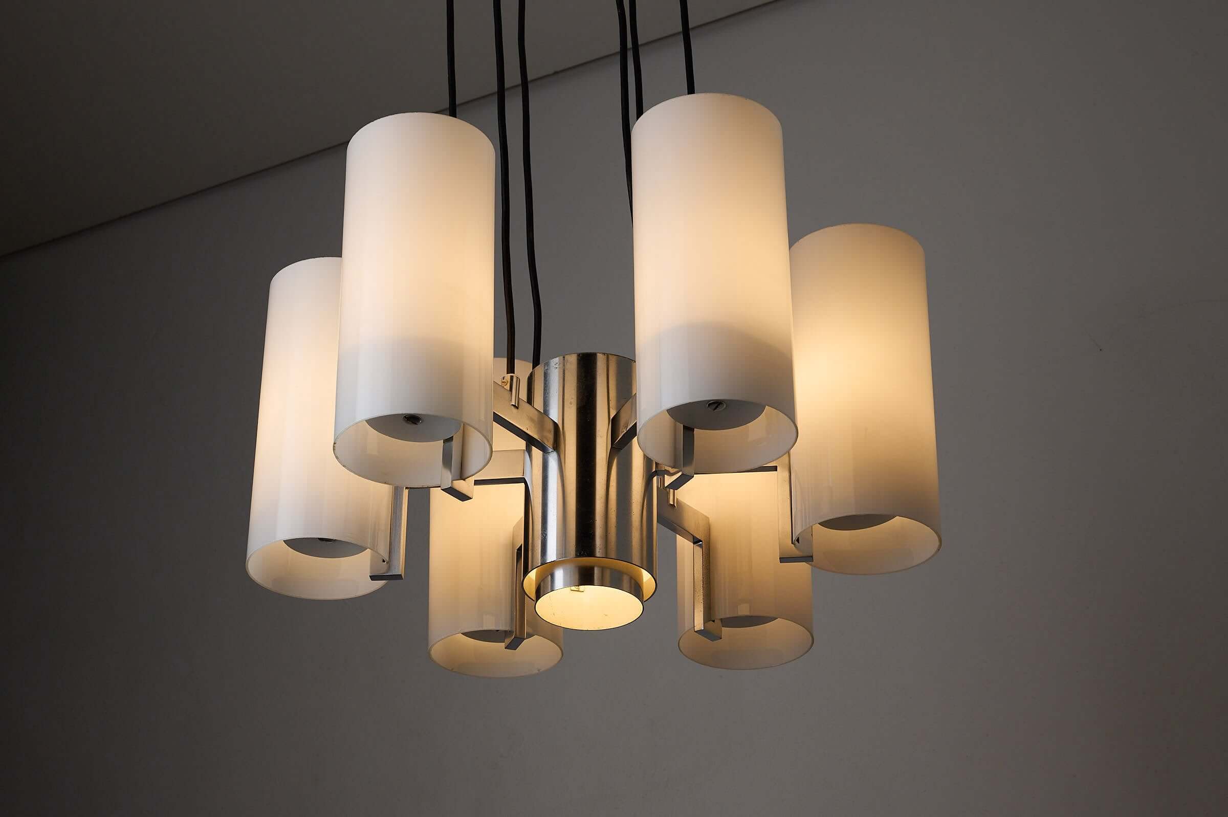 Space Age chrome chandelier with six cylindrical shades and polished chrome finish.